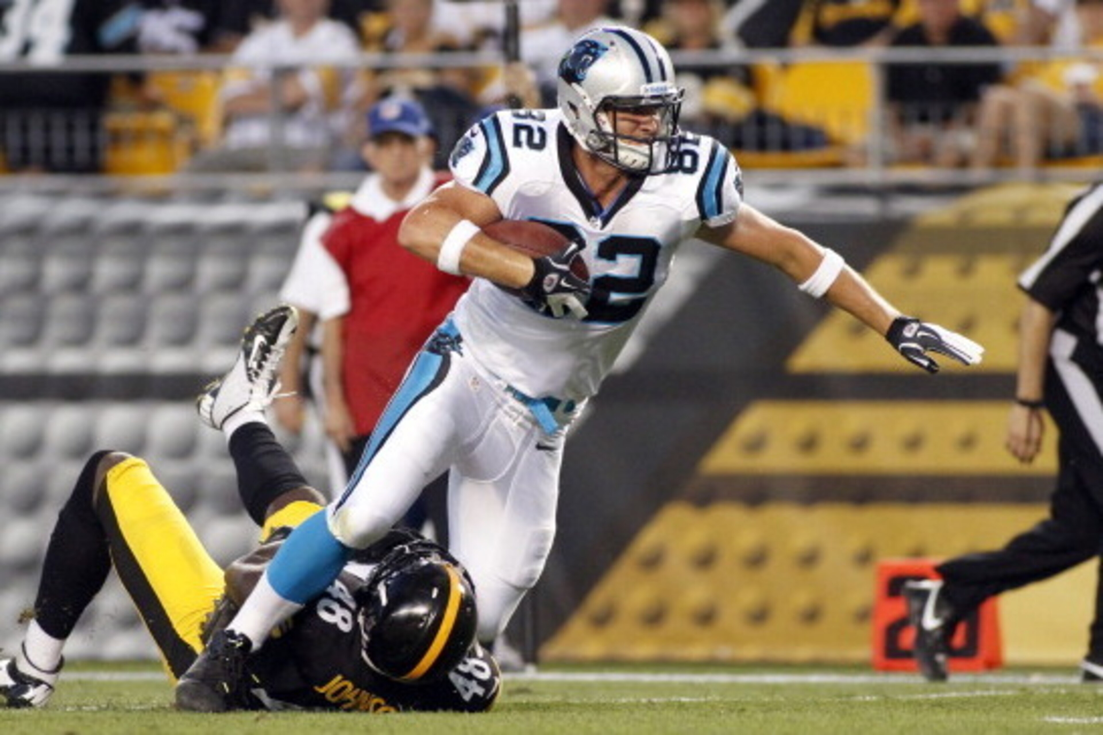 PITTSBURGH, PA - AUGUST 30:  Gary Barnidge #82 of the Carolina Panthers runs after the catch against Brandon Johnson #48 of the Pittsburgh Steelers during the preseason game on August 30, 2012 at Heinz Field in Pittsburgh, Pennsylvania.  (Photo by Justin 