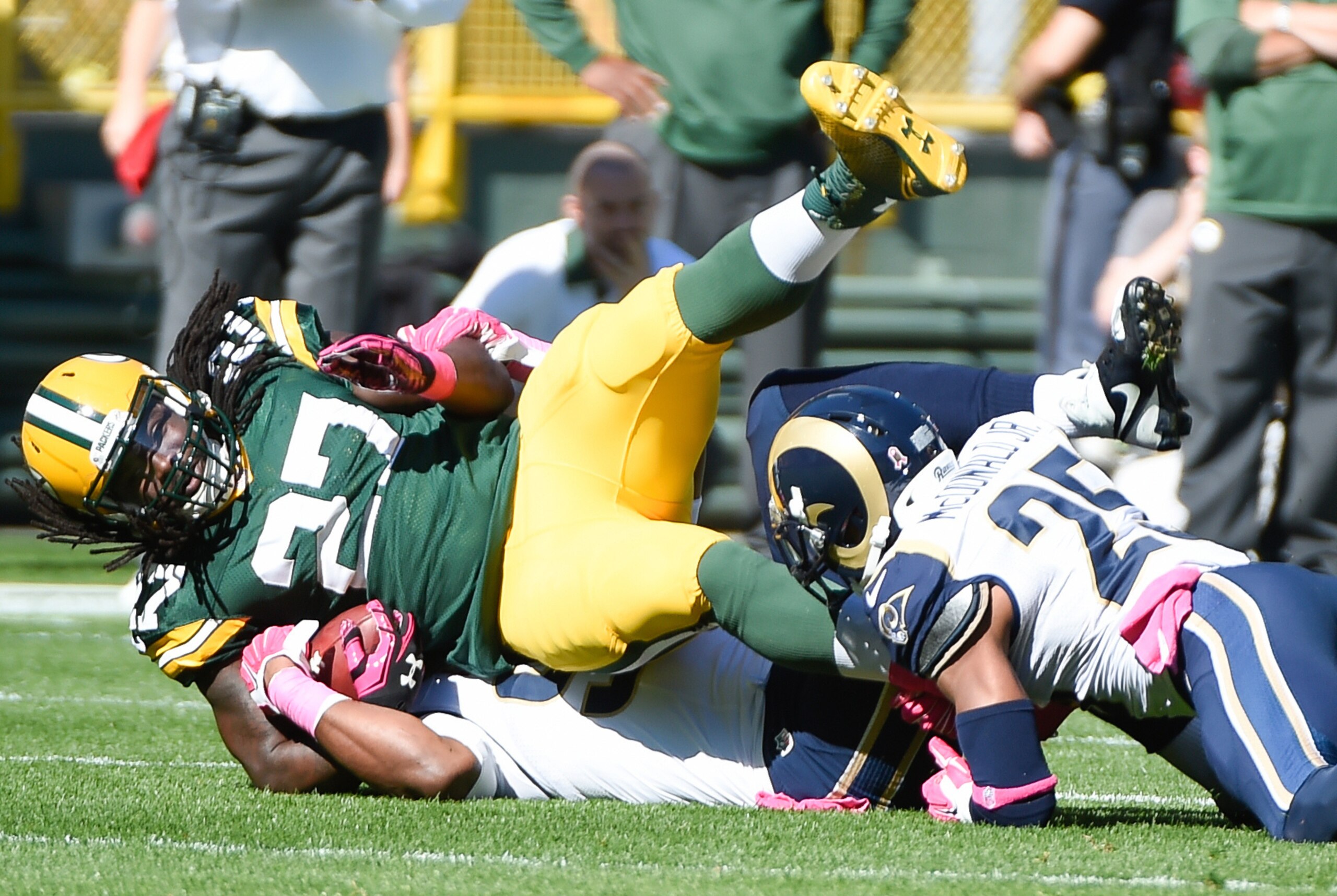 Oct 11, 2015; Green Bay, WI, USA; Green Bay Packers running back Eddie Lacy (27) is tackled by St. Louis Rams safety T.J. McDonald (25) in the first quarter at Lambeau Field. Mandatory Credit: Benny Sieu-USA TODAY Sports