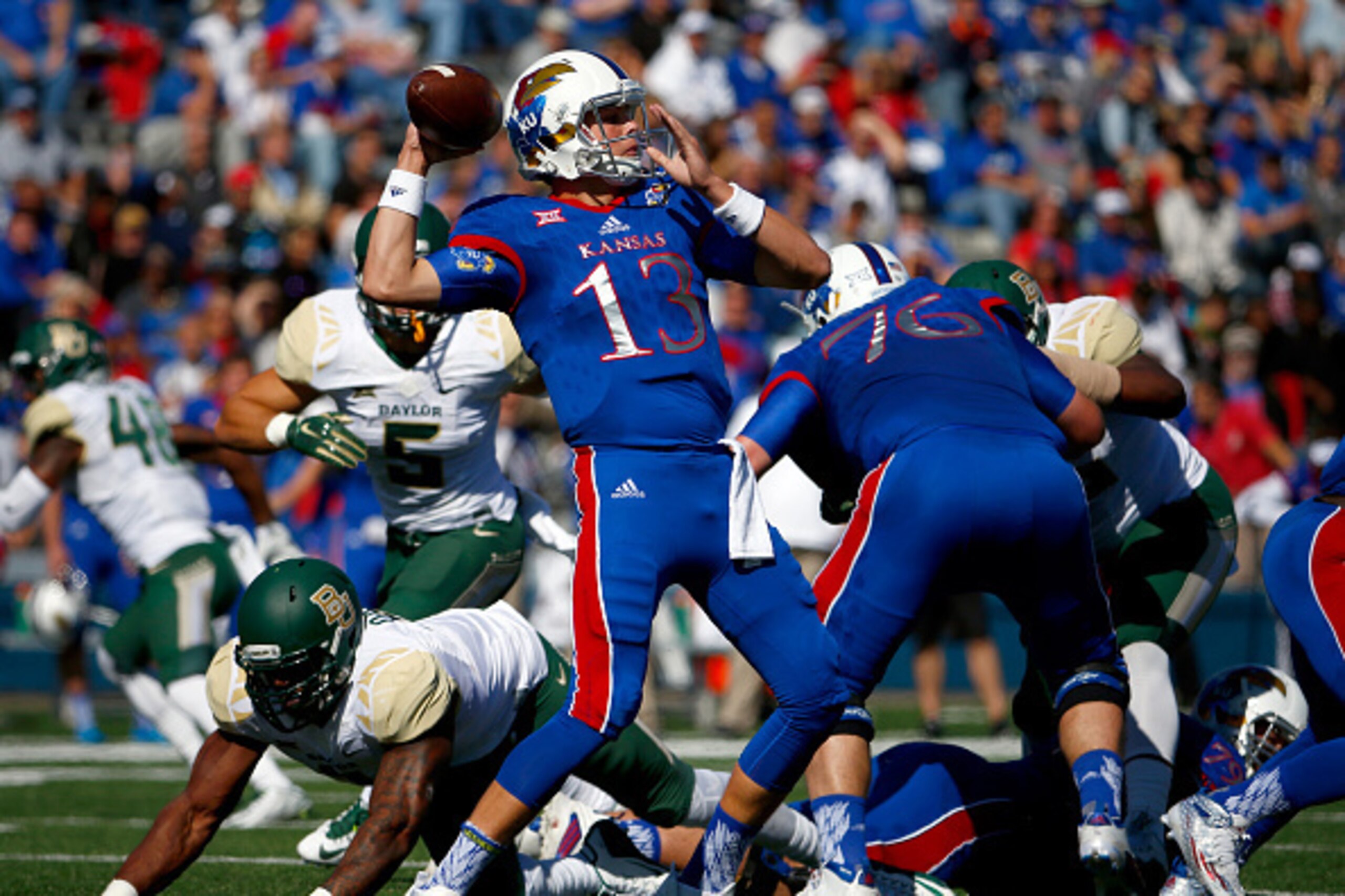 LAWRENCE, KS - OCTOBER 10:  Quarterback Ryan Willis #13 of the Kansas Jayhawks passes during the game against the Baylor Bears at Memorial Stadium on October 10, 2015 in Lawrence, Kansas.  (Photo by Jamie Squire/Getty Images)