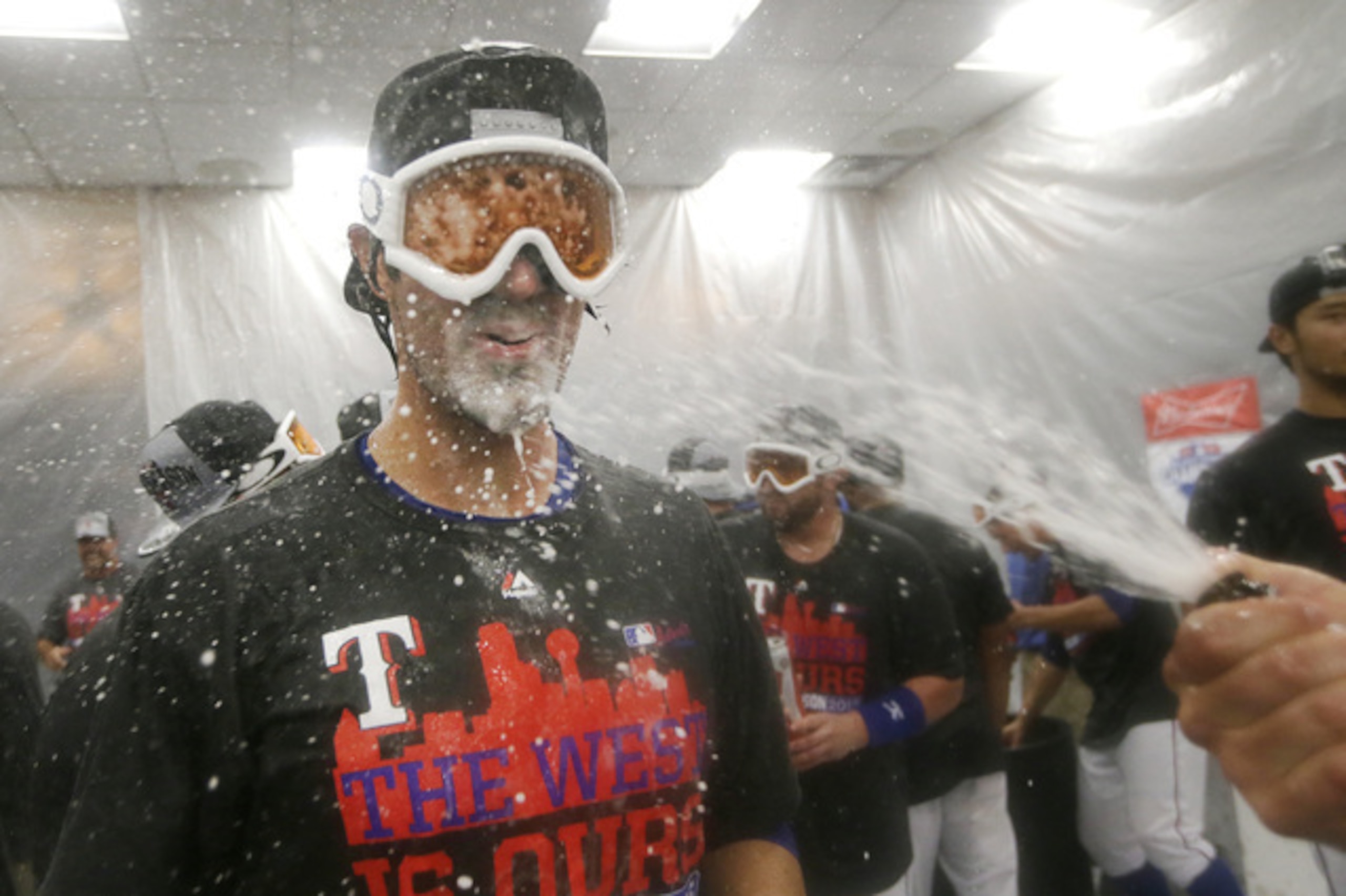 Hamels, celebrating the Rangers' AL West title, has started four potential clinching games in the postseason, and his team has won them all.