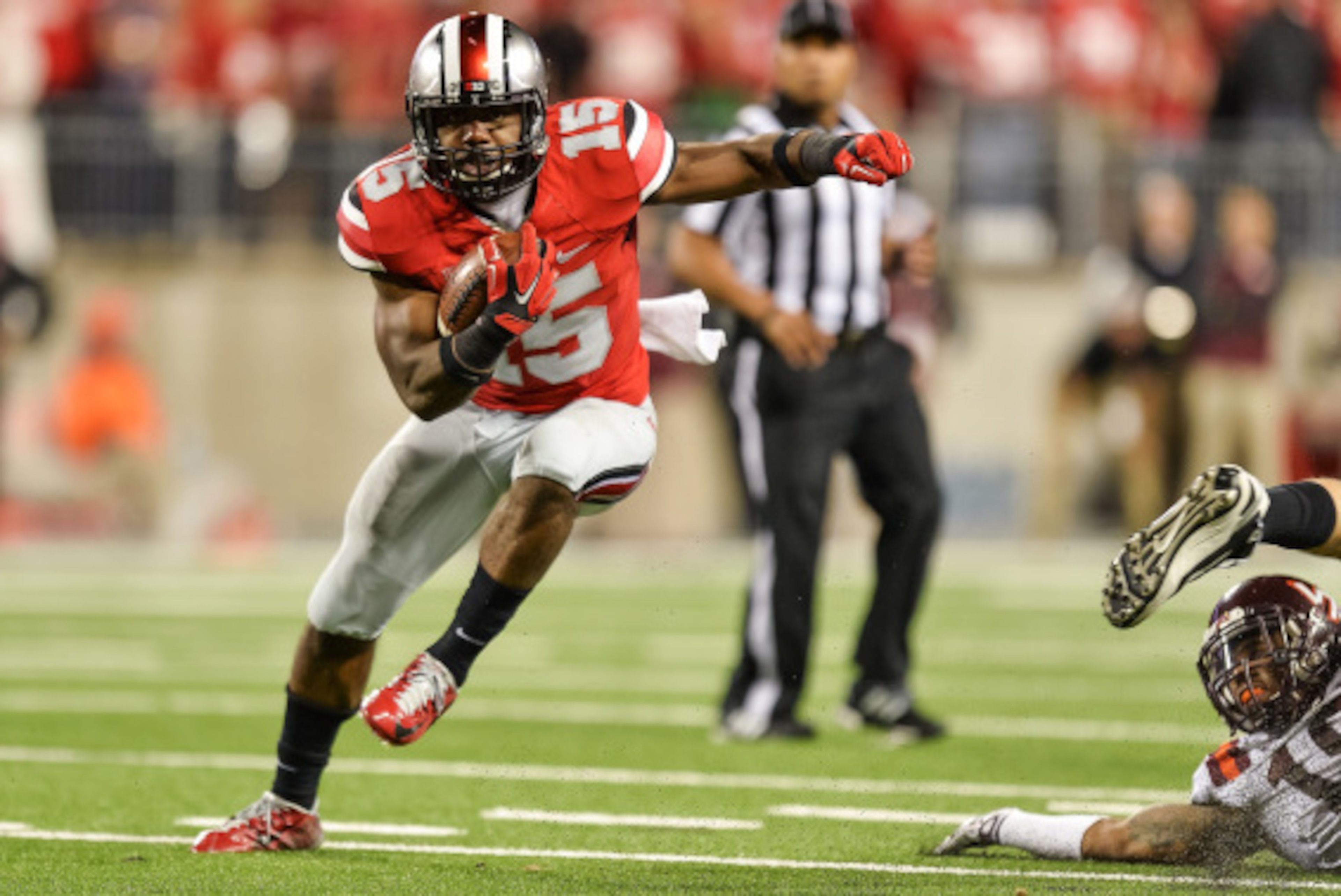 COLUMBUS, OH - SEPTEMBER 6:  Ezekiel Elliott #15 of the Ohio State Buckeyes runs with the ball  against the Virginia Tech Hokies at Ohio Stadium on September 6, 2014 in Columbus, Ohio.  (Photo by Jamie Sabau/Getty Images)