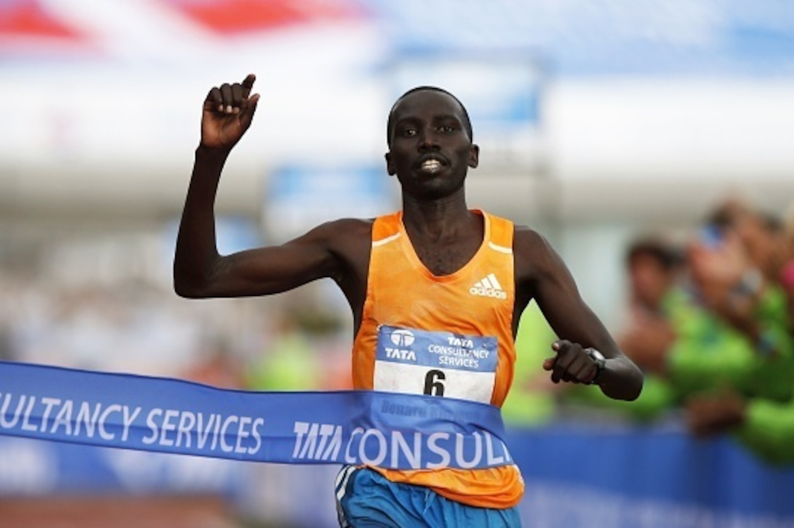 Kenya's Bernard Kipyego gestures as he crosses the finish line to win the Amsterdam Marathon on October 19, 2014. AFP PHOTO/ANP/JERRY LAMPEN
== NETHERLANDS OUT ==        (Photo credit should read JERRY LAMPEN/AFP/Getty Images)