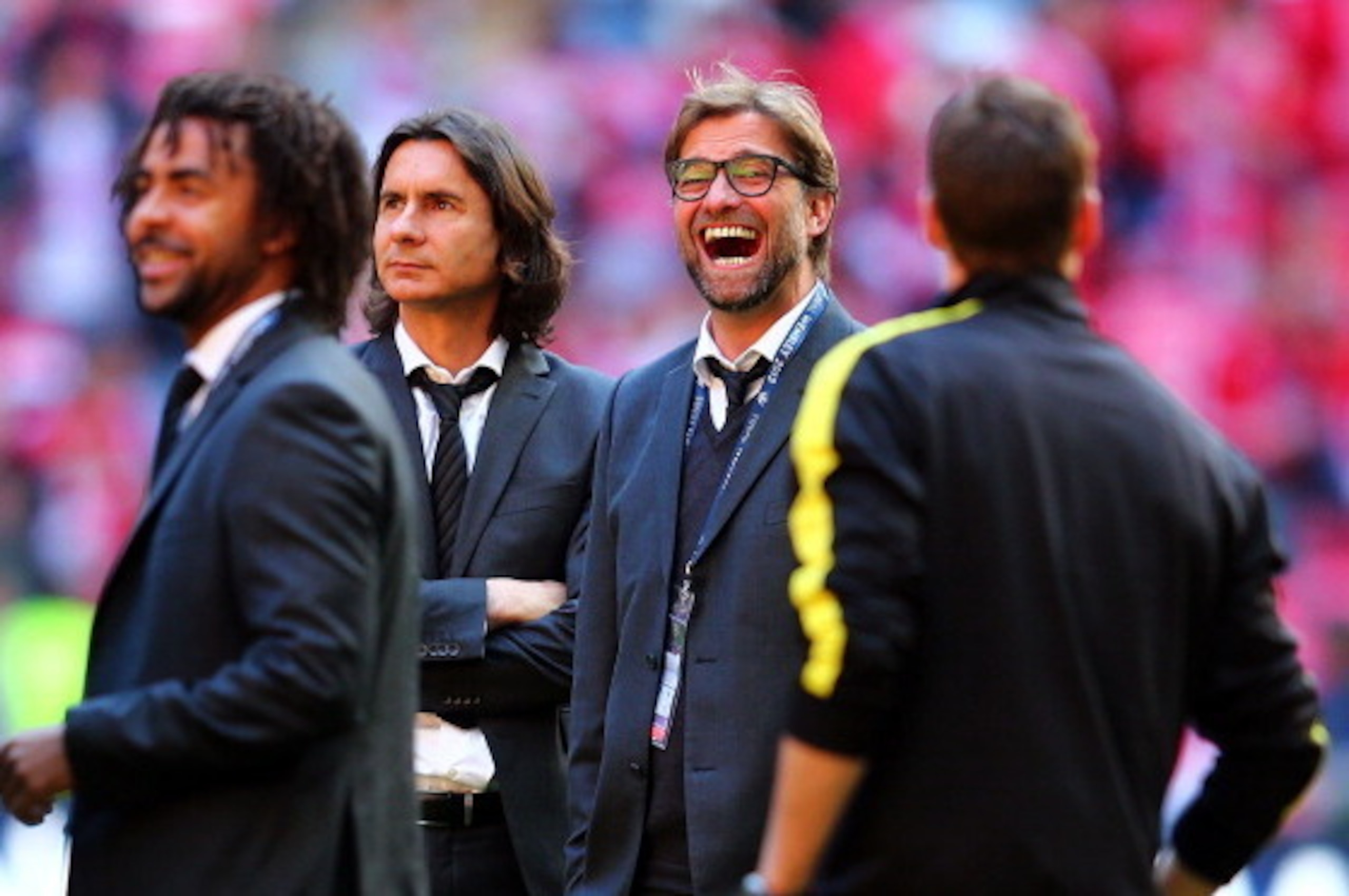 LONDON, ENGLAND - MAY 25:  Head Coach Jurgen Klopp of Borussia Dortmund (2R)  jokes with coaching staff prior to the UEFA Champions League final match between Borussia Dortmund and FC Bayern Muenchen at Wembley Stadium on May 25, 2013 in London, United Ki
