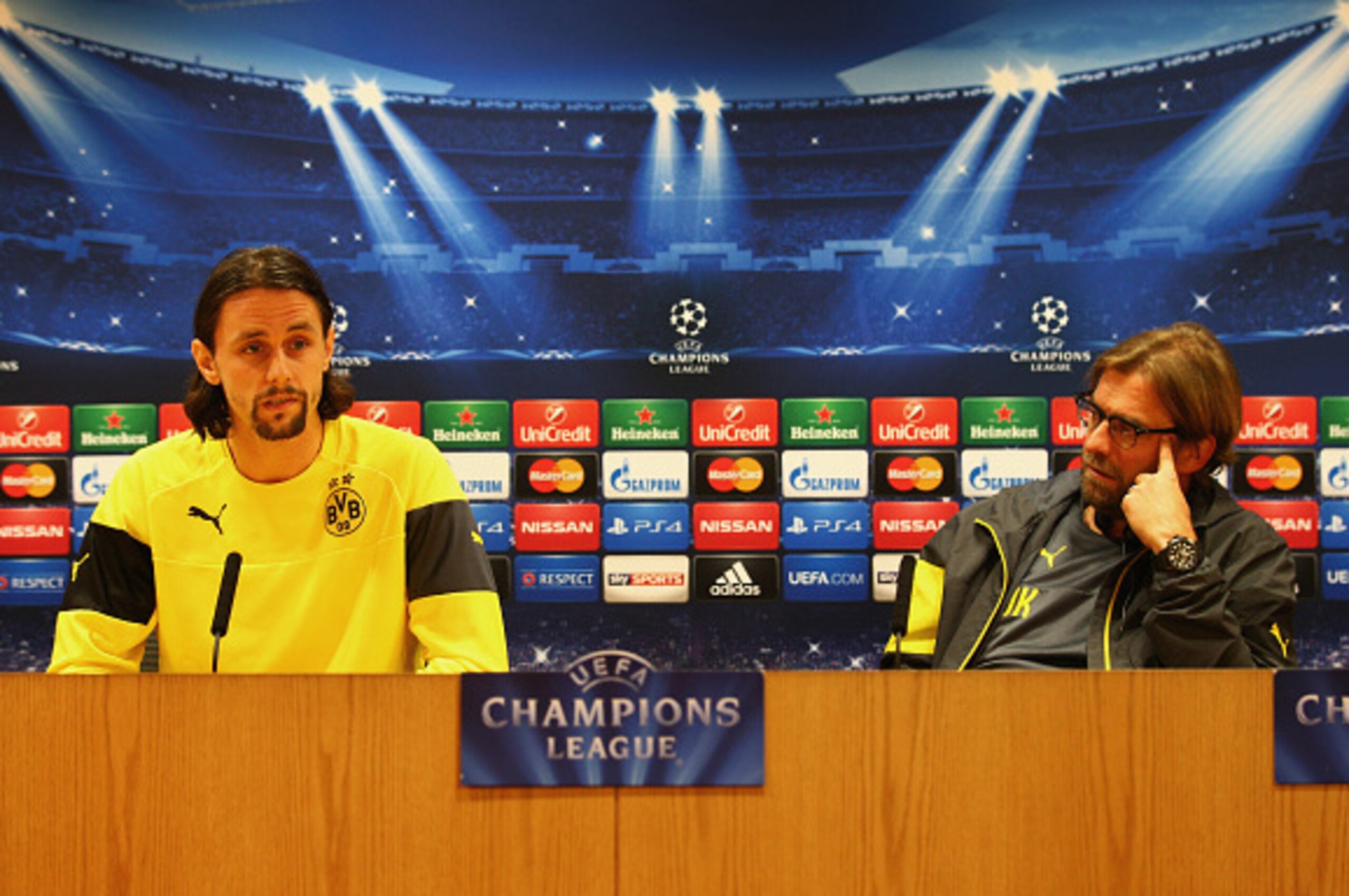 LONDON, ENGLAND - NOVEMBER 25:  Jurgen Klopp manager of Borussia Dortmund (R) and defender Neven Subotic look on during a Borussia Dortmund press conference, ahead of the UEFA Champions League Group D match against Arsenal, at Emirates Stadium on November