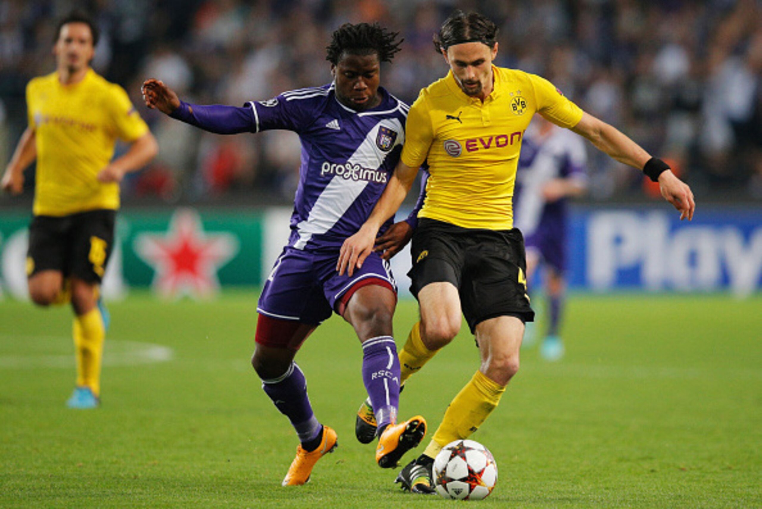 ANDERLECHT, BELGIUM - OCTOBER 01:  Nathan Kabasele of Anderlecht battles with Neven Subotic of Borussia Dortmund during the UEFA Champions League Group D match between RSC Anderlecht and Borussia Dortmund at Constant Vanden Stock Stadium on October 1, 201