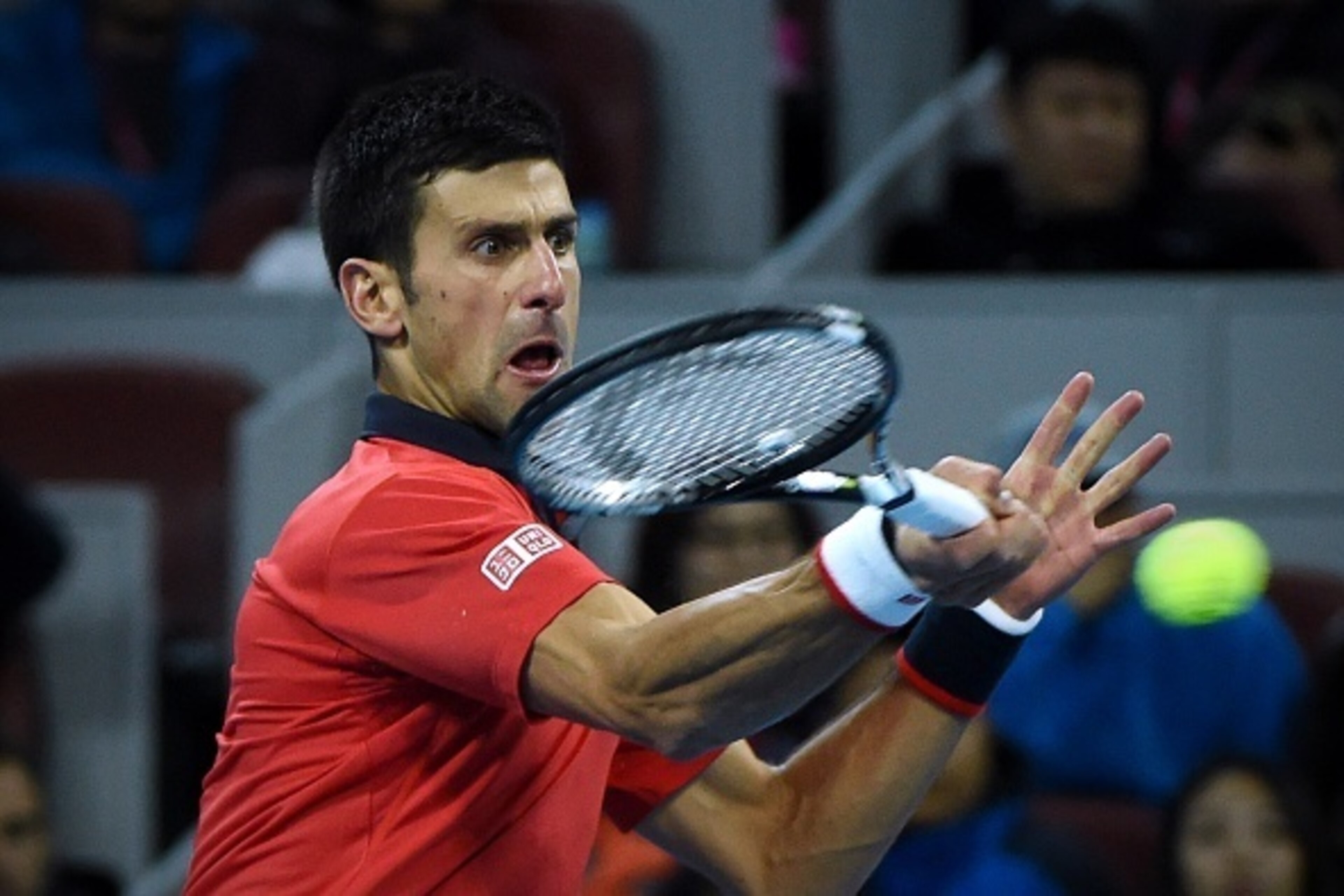 Novak Djokovic of Serbia hits a return against Rafael Nadal of Spain during the men's singles final at the China Open tennis tournament in Beijing on October 11, 2015. AFP PHOTO / WANG ZHAO        (Photo credit should read WANG ZHAO/AFP/Getty Images)