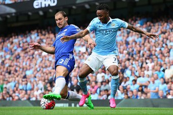 MANCHESTER, ENGLAND - AUGUST 16: Raheem Sterling of Manchester City takes on Branislav Ivanovic of Chelsea during the Barclays Premier League match between Manchester City and Chelsea at the Etihad Stadium on August 16, 2015 in Manchester, England.  (Phot