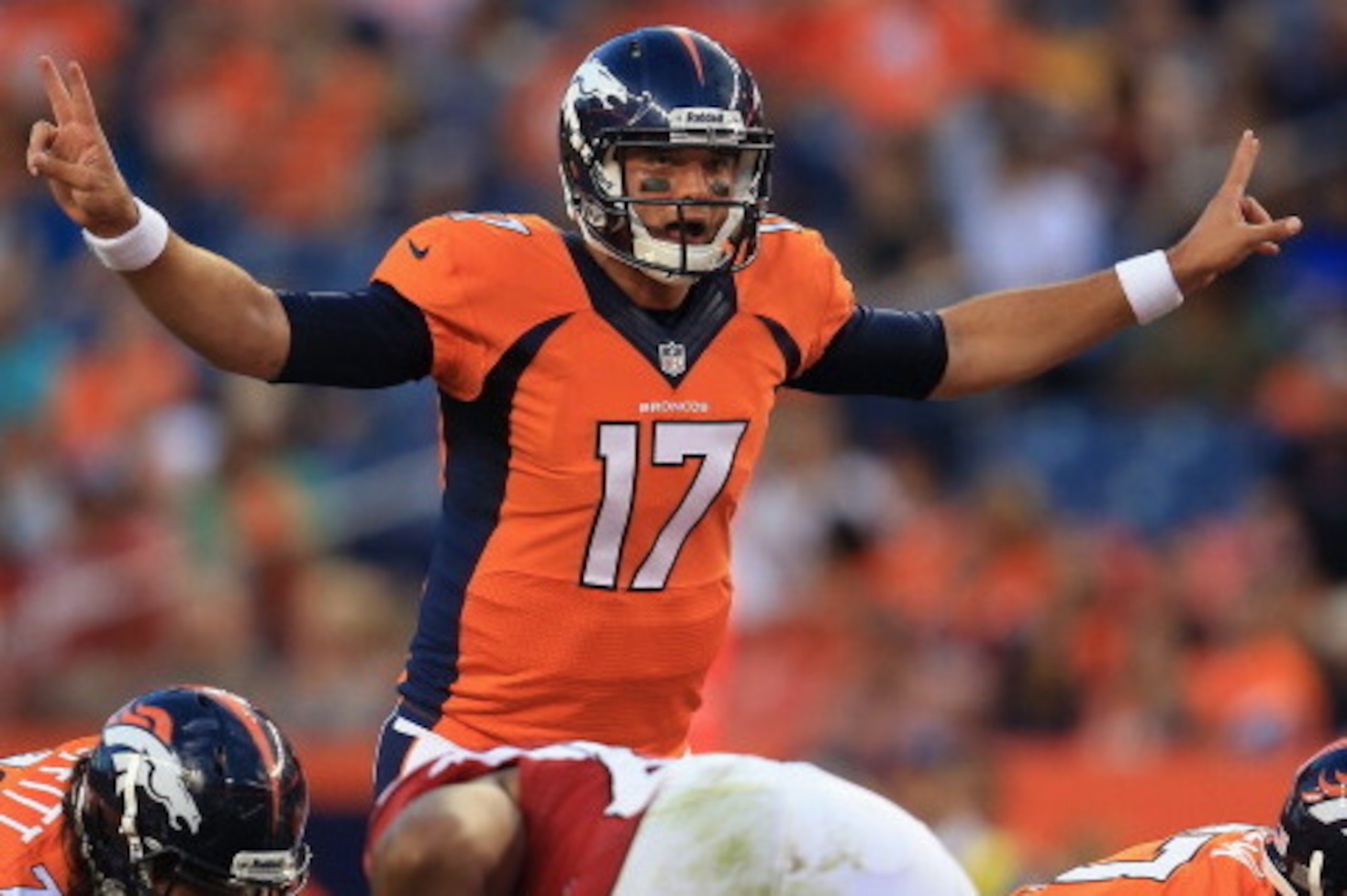 DENVER, CO - AUGUST 29:  Quarterback Brock Osweiler #17 of the Denver Broncos runs the offense against the Arizona Cardinals during preseason action at Sports Authority Field at Mile High on August 29, 2013 in Denver, Colorado. The Cardinals defeated the 