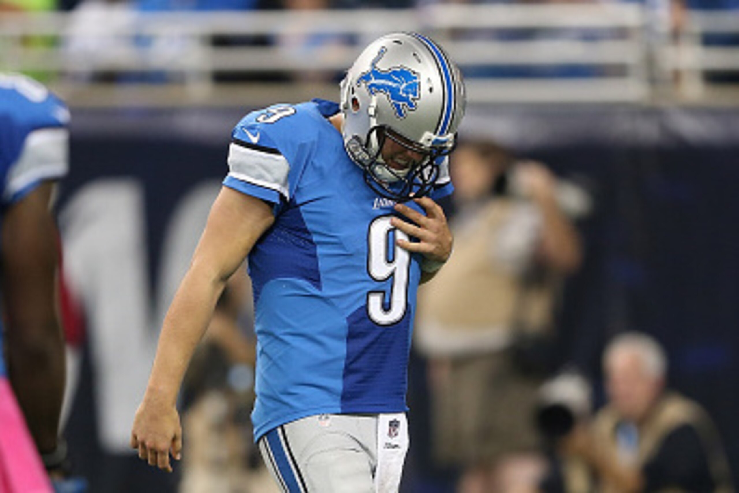 DETROIT MI - OCTOBER 11: Matthew Stafford #9 of the Detroit Lions walks off the field holding his shoulder while playing the Arizona Cardinals on October 11, 2015 at Ford Field in Detroit, Michigan.  (Photo by Leon Halip/Getty Images)