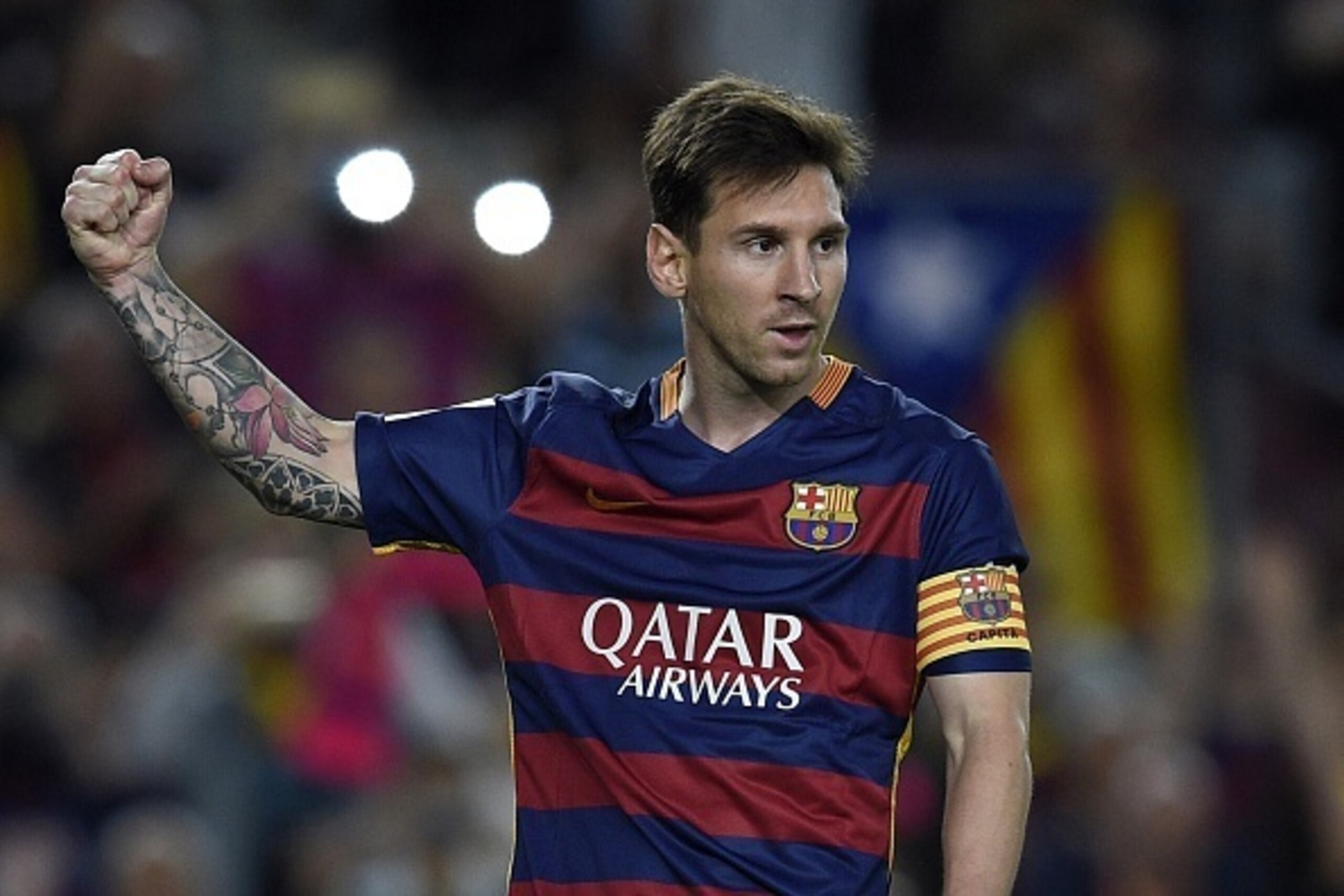 Barcelona's Argentinian forward Lionel Messi celebrates after scoring a goal on a penalty kick during the Spanish league football match FC Barcelona vs Levante UD at the Camp Nou stadium in Barcelona on September 20, 2015.   AFP PHOTO/ LLUIS GENE        (