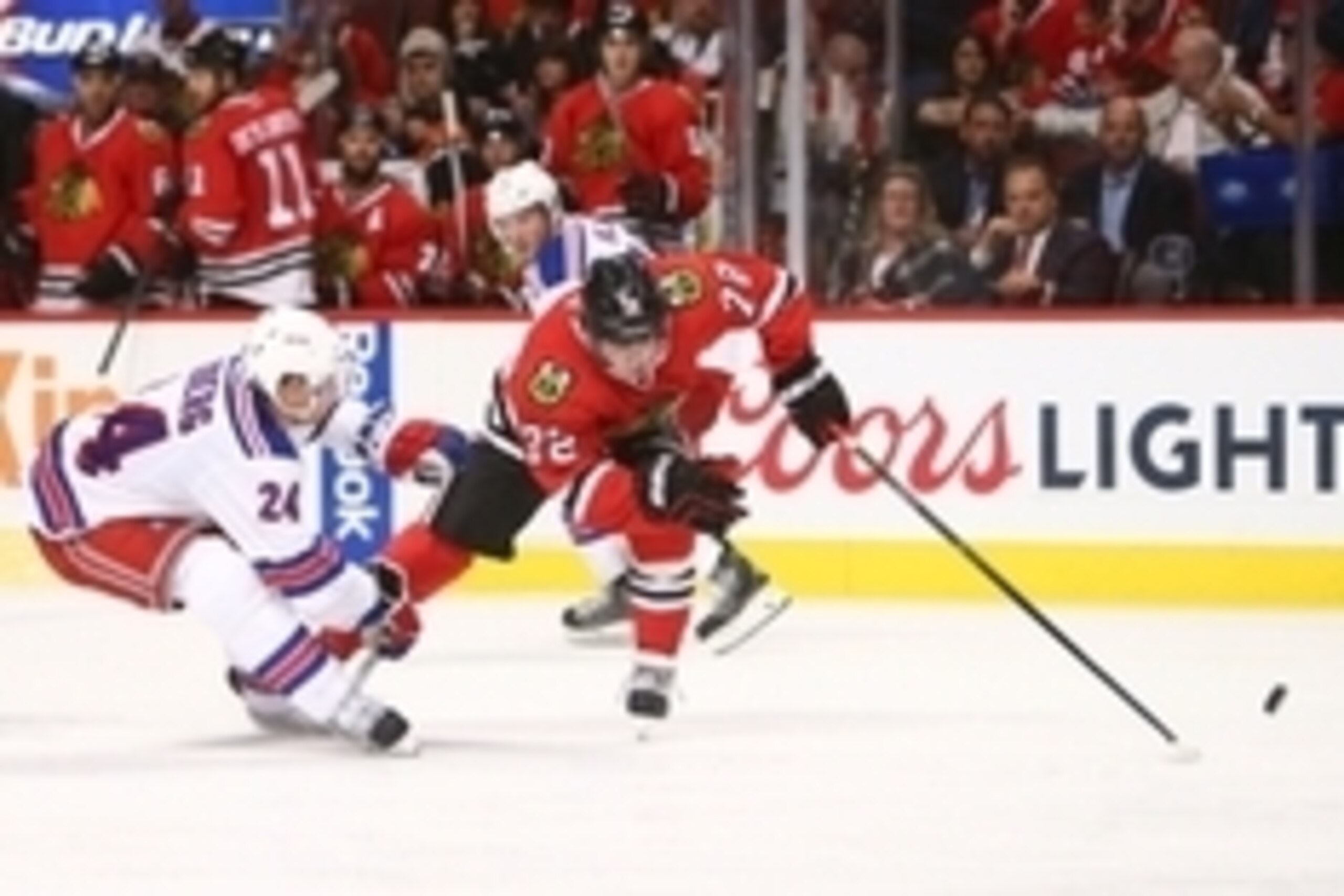 Oct 7, 2015; Chicago, IL, USA; Chicago Blackhawks left wing Artemi Panarin (72) battles for the puck with New York Rangers center Oscar Lindberg (24) in the third period at United Center. Mandatory Credit: Jerry Lai-USA TODAY Sports