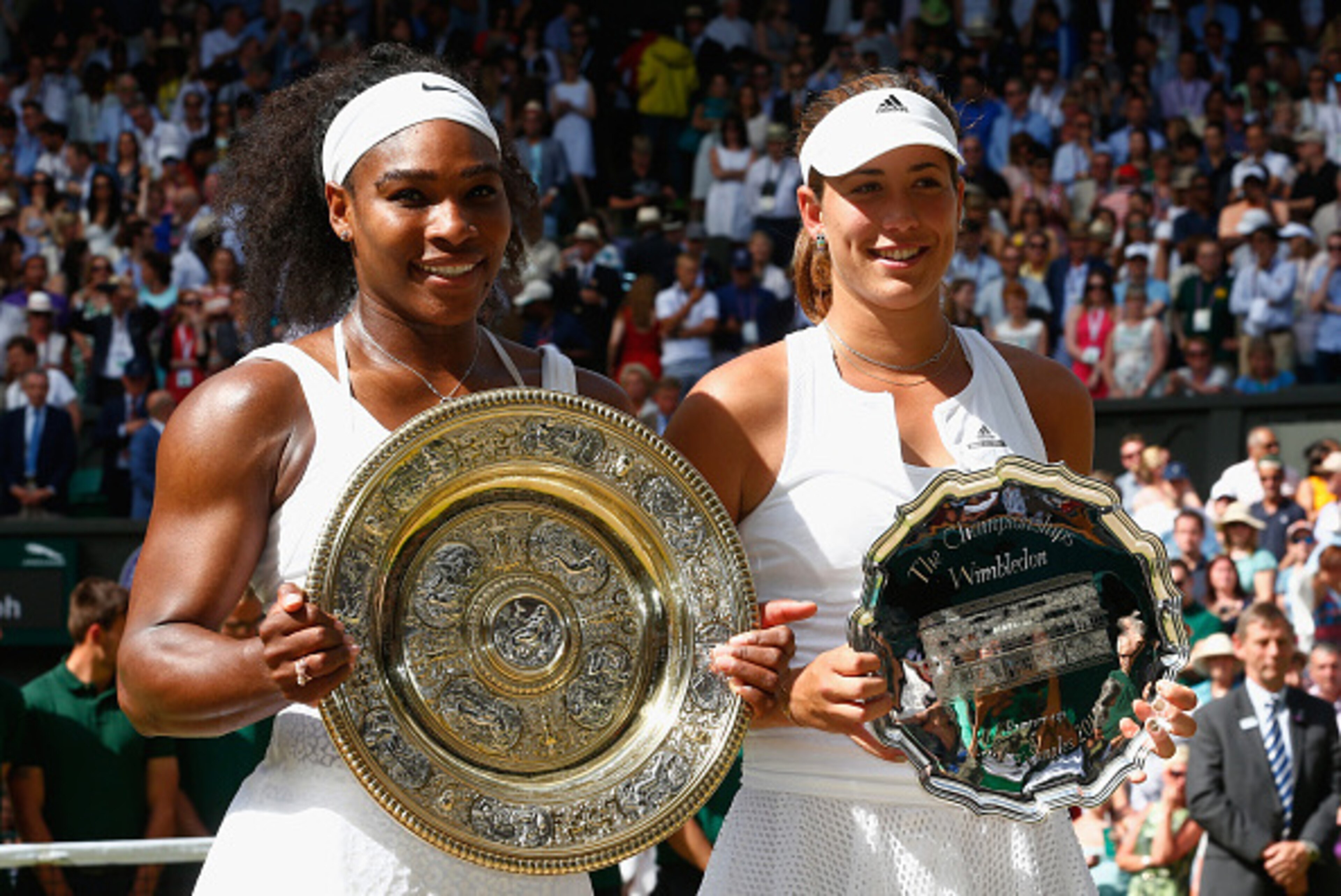 LONDON, ENGLAND - JULY 11: Serena Williams of the United States holds the Venus Rosewater Dish next to Garbine Muguruza of Spain holding the runners up trophy after her victory in the Final Of The Ladies' Singles against during day twelve of the Wimbledo LONDON, ENGLAND - JULY 11: Serena Williams of the United States holds the Venus Rosewater Dish next to Garbine Muguruza of Spain holding the runners up trophy after her victory in the Final Of The Ladies' Singles against during day twelve of the Wimbledo