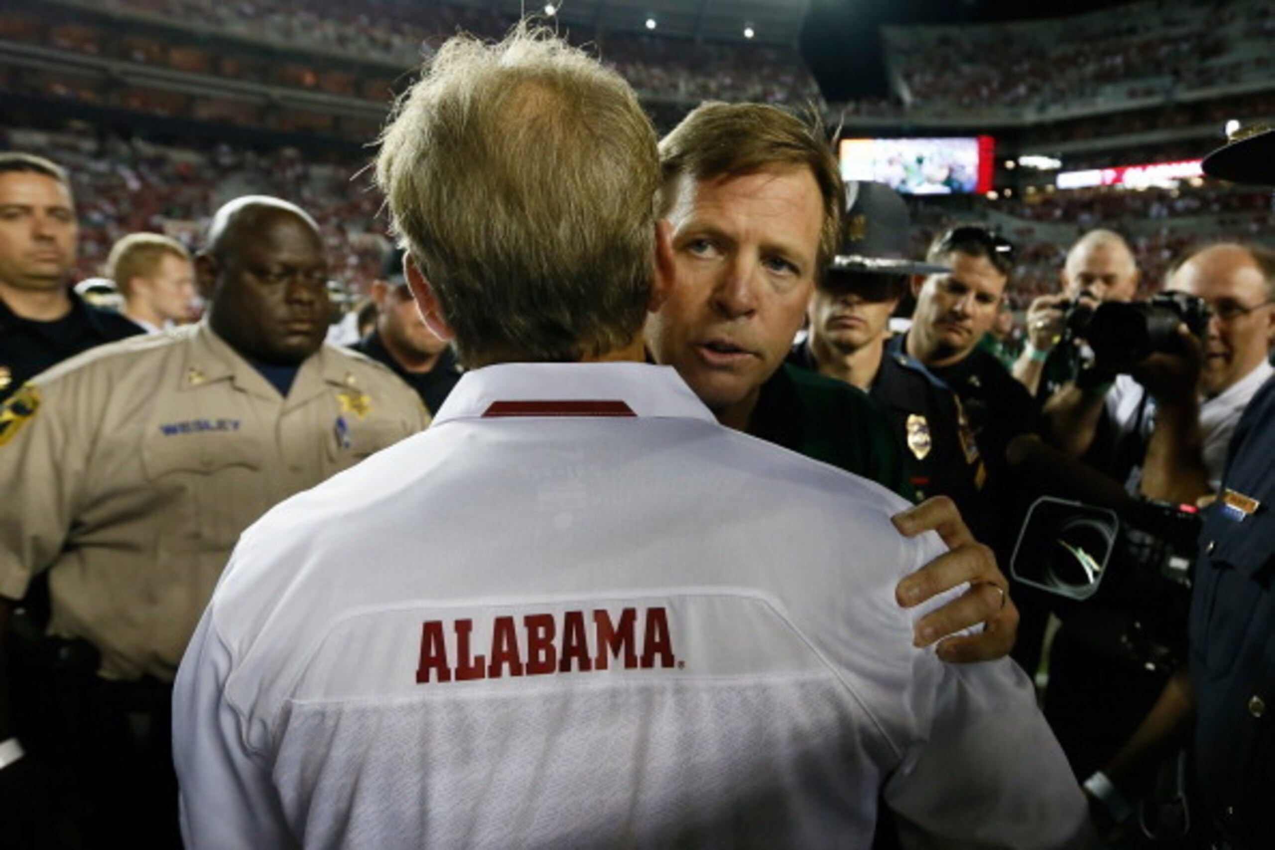 TUSCALOOSA, AL - SEPTEMBER 21:  Head coach Jim McElwain of the Colorado State Rams hugs head coach Nick Saban of the Alabama Crimson Tide after their 31-6 loss at Bryant-Denny Stadium on September 21, 2013 in Tuscaloosa, Alabama.  (Photo by Kevin C. Cox/G