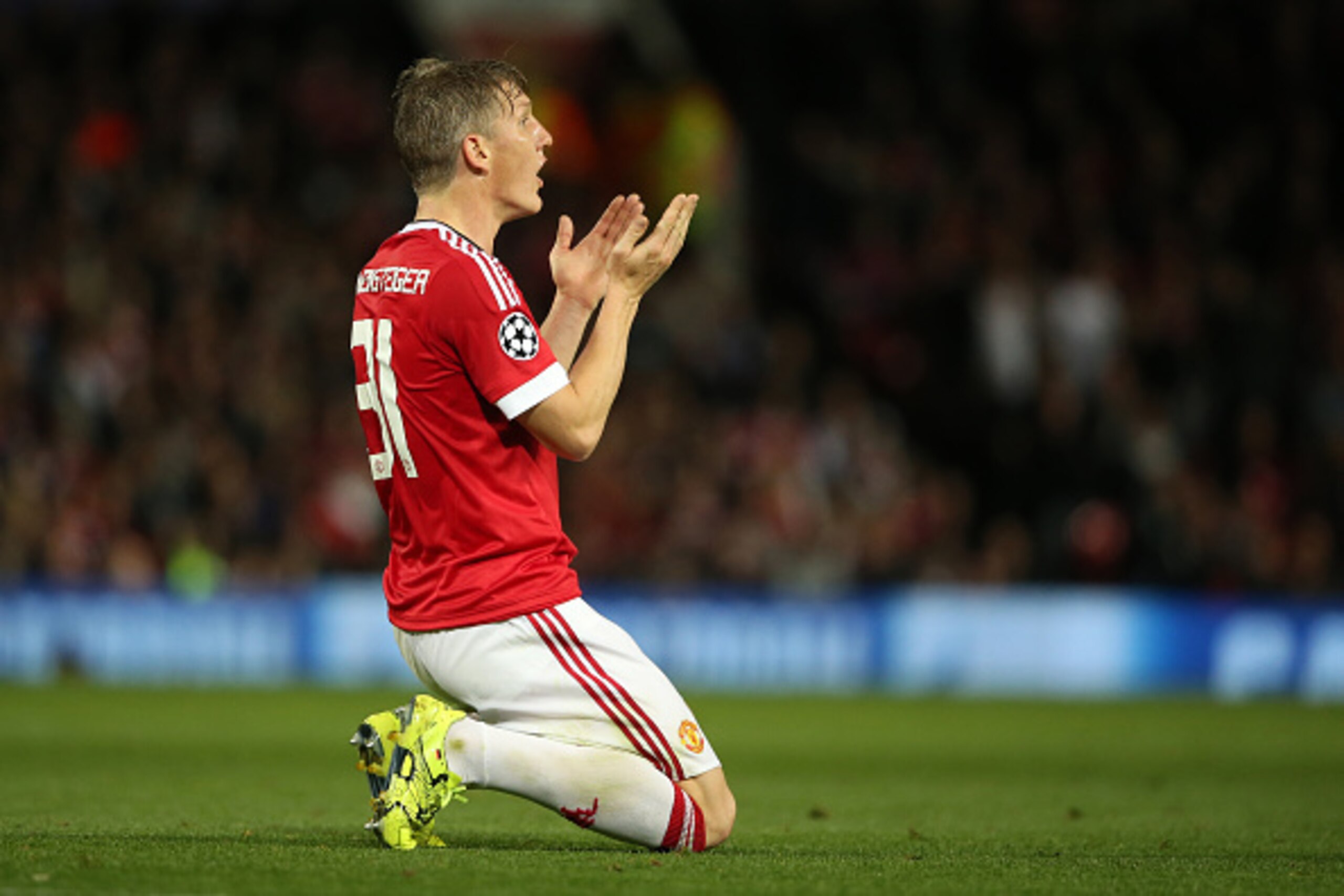 MANCHESTER, ENGLAND - SEPTEMBER 30:  Bastian Schweinsteiger of Manchester United reacts after receiving a yellow card during the UEFA Champions League match between Manchester United and Wolfsburg at Old Trafford on September 30, 2015 in Manchester, Unite