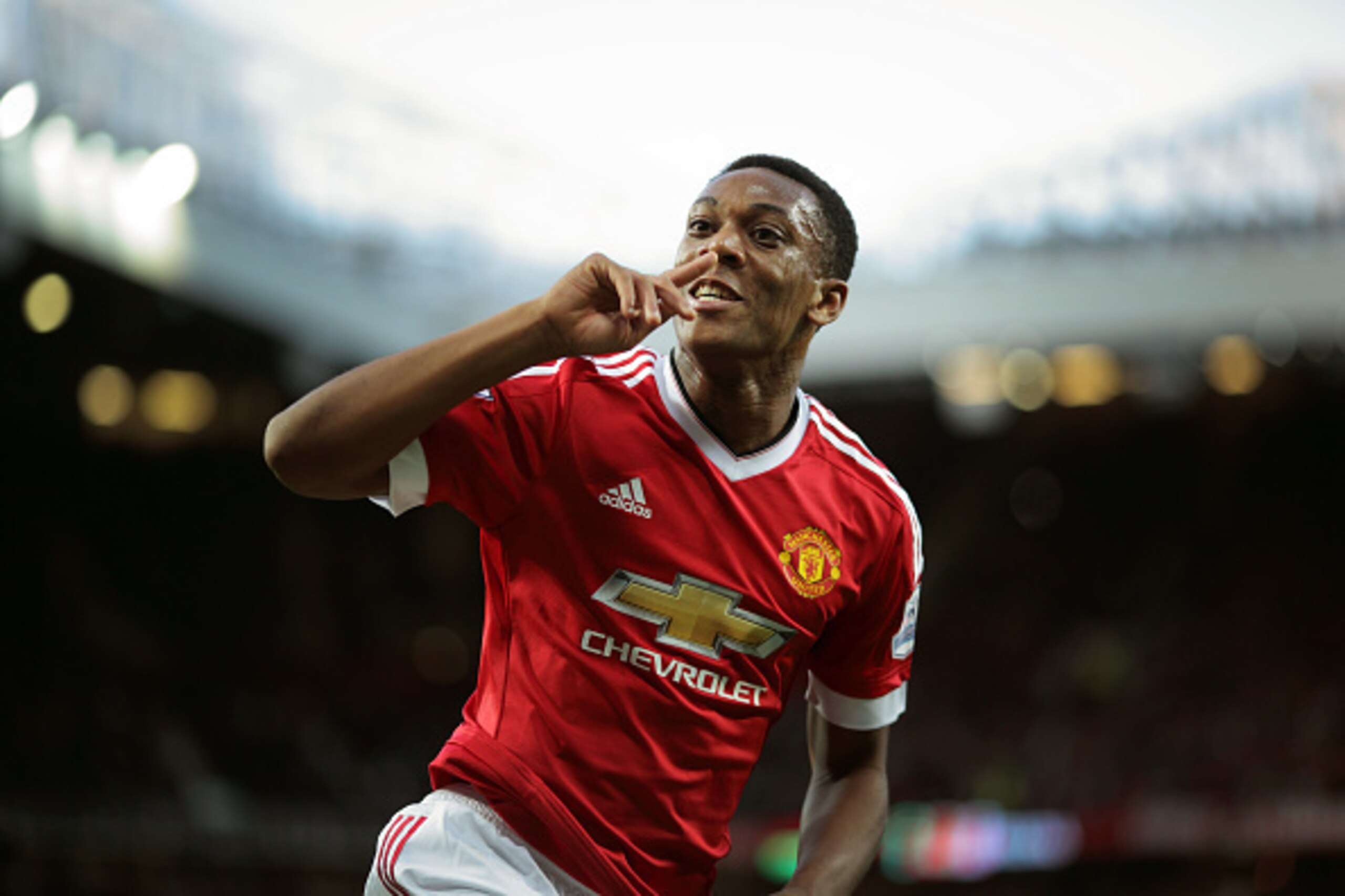 MANCHESTER, ENGLAND - SEPTEMBER 12:  Anthony Martial of Manchester United celebrates after scoring a goal to make it 3-1 on his debut  during the Barclays Premier League match between Manchester United and Liverpool on September 12, 2015 in Manchester, Un
