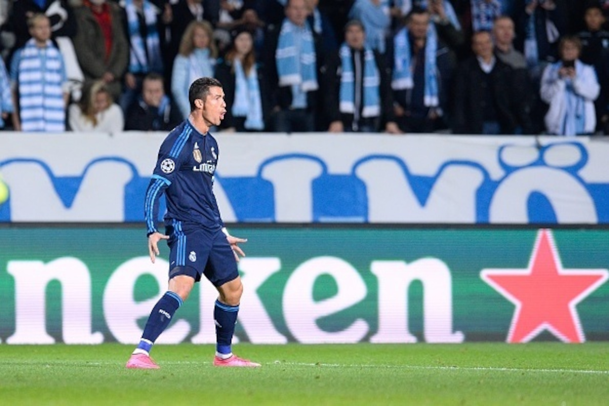 Real Madrid's Portuguese forward Cristiano Ronaldo celebrates after scoring the opening goal during the UEFA Champions League first-leg Group A football match between Malmo FF and Real Madrid CF at the Swedbank Stadion, in Malmo, Sweden on September 30, 2