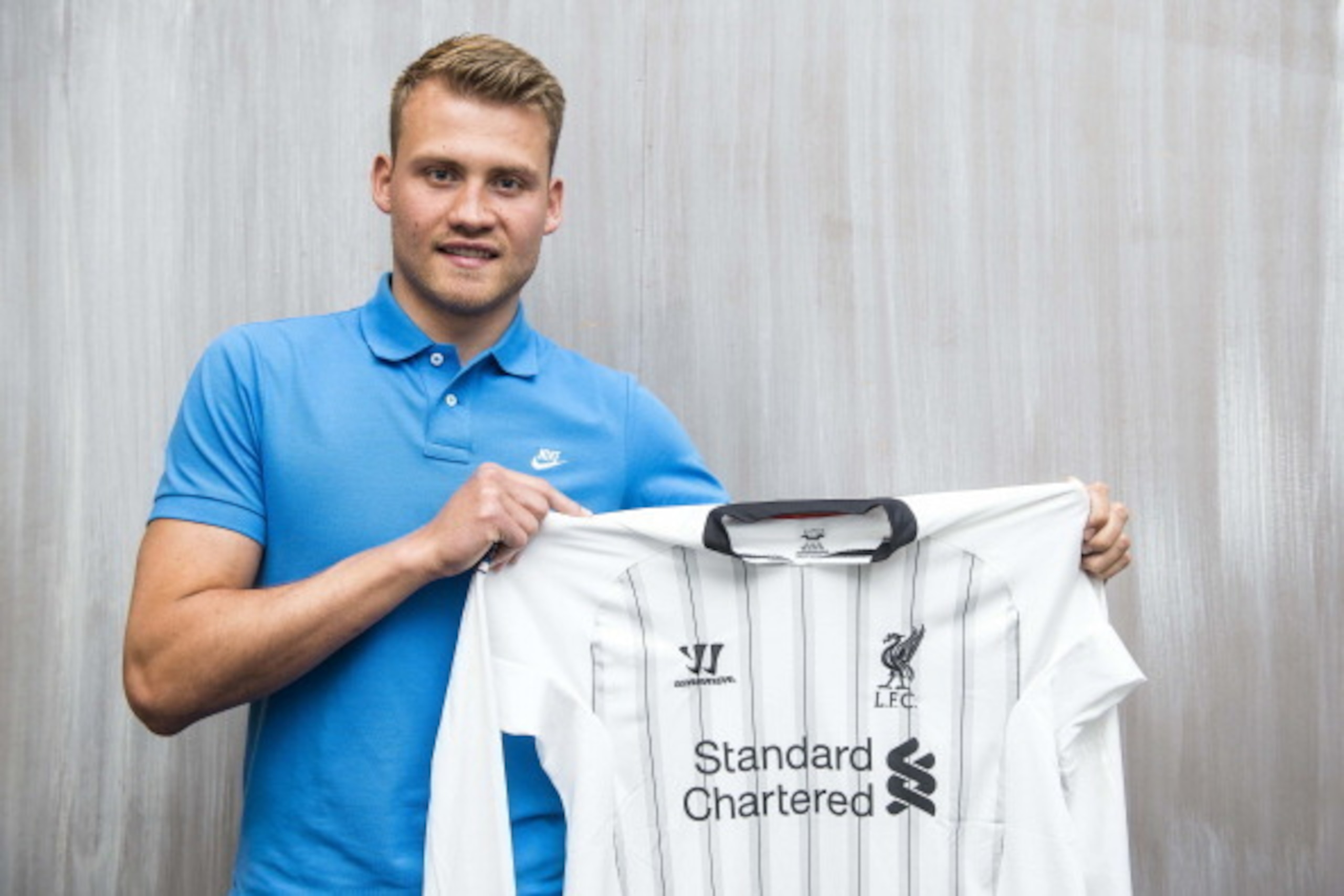 Belgian international goalkeeper Simon Mignolet poses with his new jersey of English Premier League side Liverpool after giving a press conference, on June 27, 2013  in Sint-Truiden. Belgian international goalkeeper Simon Mignolet became Liverpool's fourt
