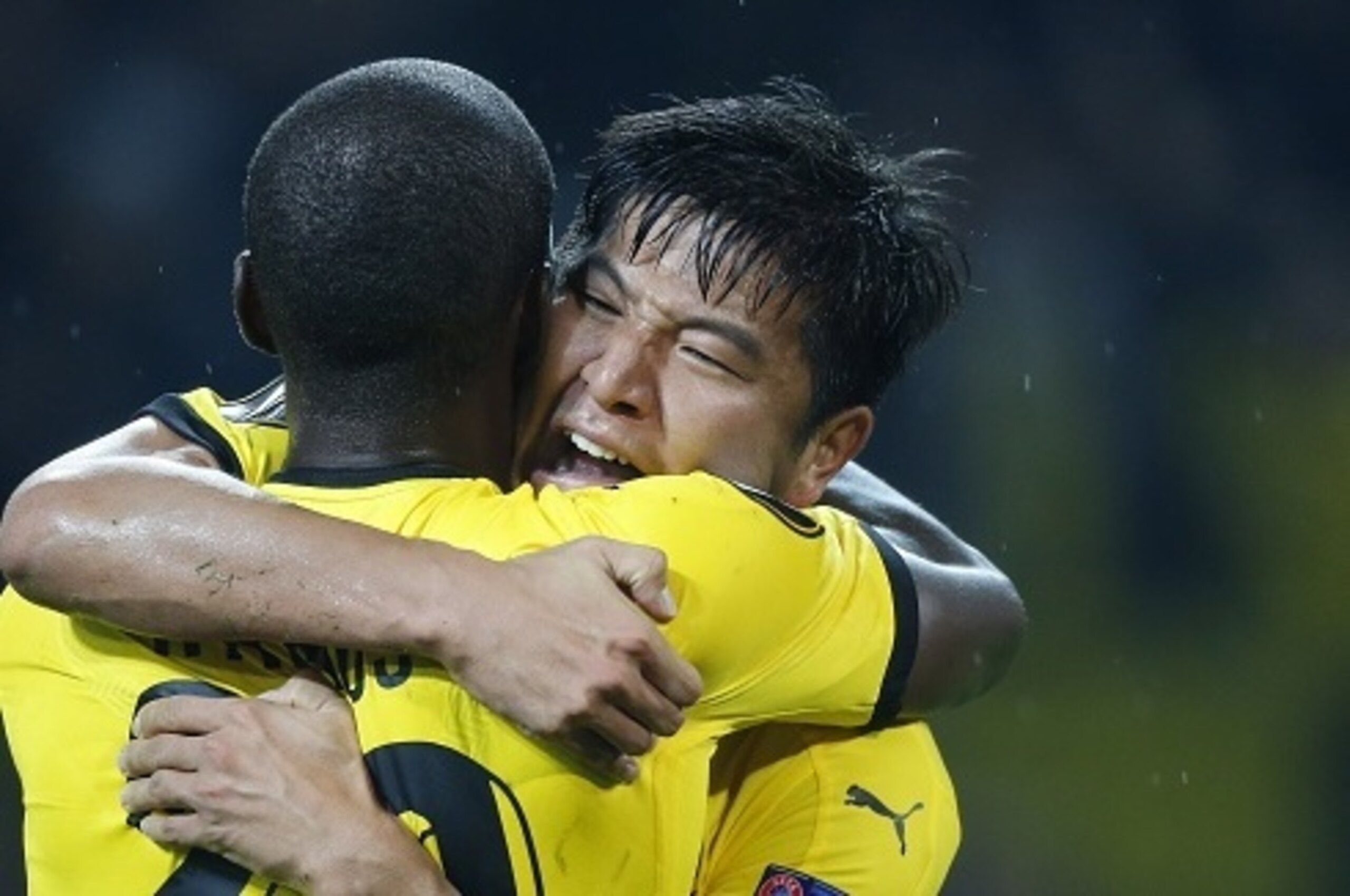 Dortmund's Korean defender Park Joo-Ho (R) celebrates with his teammate Dortmund's Columbian striker Adrian Ramos after scoring the 2-1 during the UEFA Europa League Group C football match between Borussia Dortmund and FC Krasnodar in Dortmund, western Ge