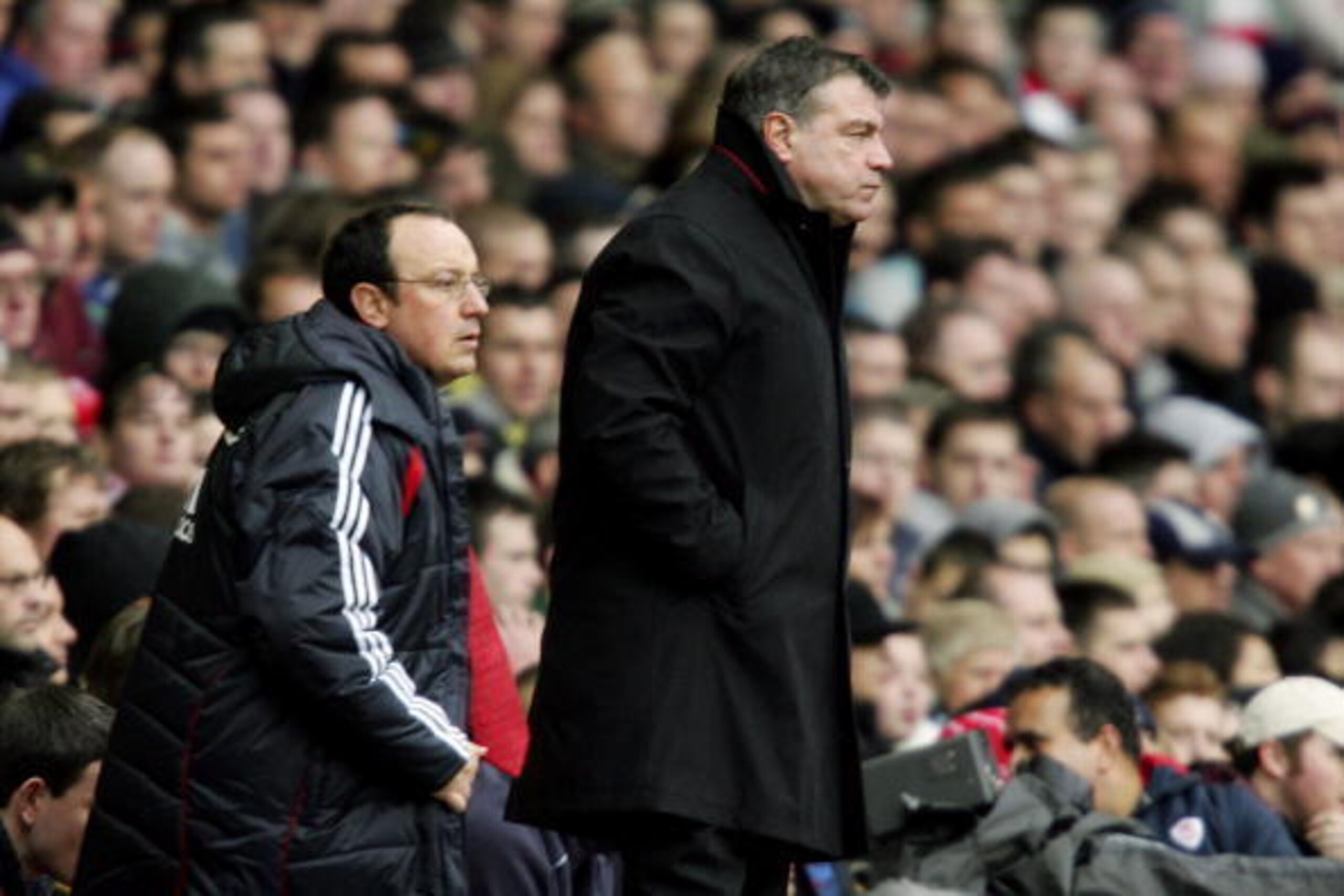 LIVERPOOL, UNITED KINGDOM - JANUARY 01:  Liverpool manager Rafael Benitez (L) and Sam Allardyce the manager of Bolton Wanderers watch the Barclays Premiership match between Liverpool and Bolton Wanderers at Anfield on January 1, 2007 in Liverpool, England