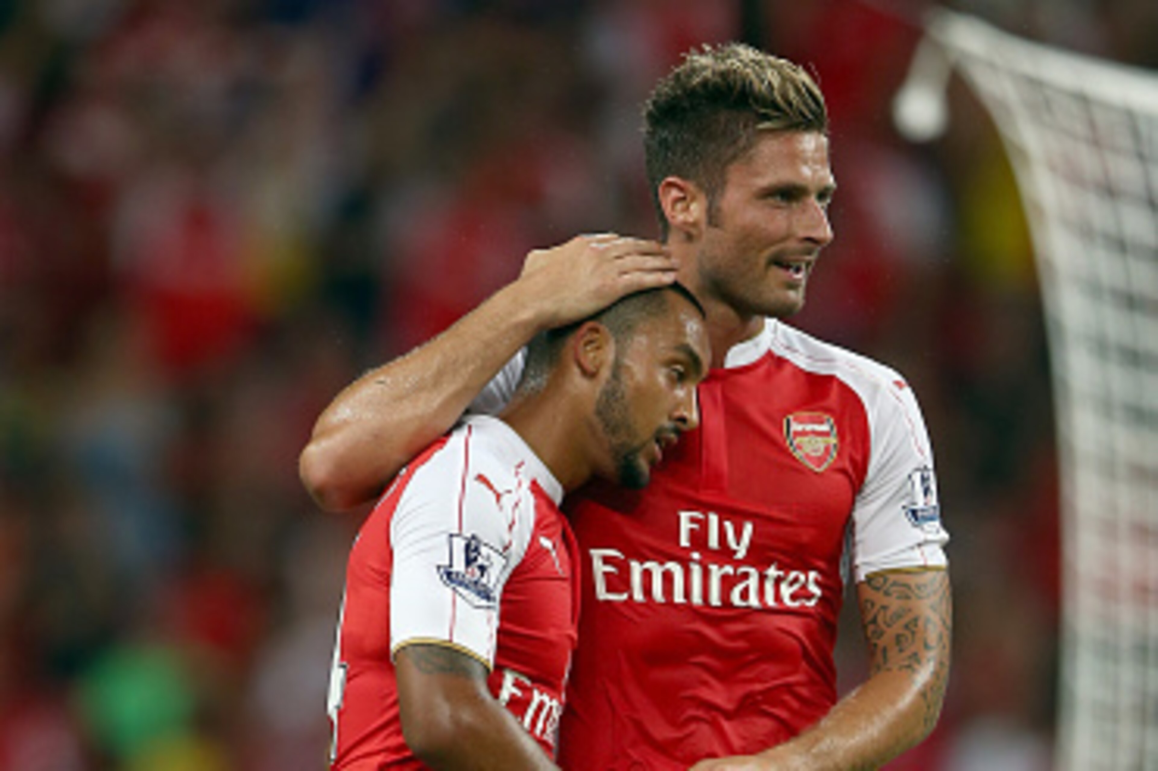 SINGAPORE - JULY 18:  Theo Walcott of Arsenal celebrates with Olivier Giroud after scoring the 1st goal against Everton during the Barclays Asia Trophy final match between Arsenal and Everton at the National Stadium on July 18, 2015 in Singapore.  (Photo 