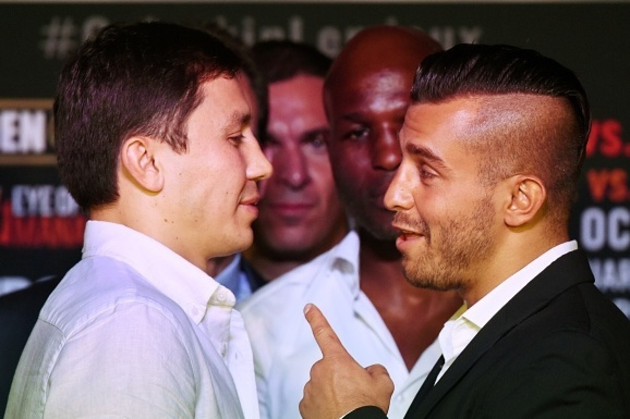 Boxers Gennady 'GGG' Golovkin of Kazakhstan (L) and David Lemieux of Canada (R) face off during their press conference to promote their upcoming Middleweight World Championship Title Unification bout, in Los Angeles, California on August 20, 2015.  The fi