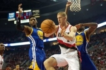 Oct 8, 2015; Portland, OR, USA;  Portland Trail Blazers forward Mason Plumlee (24) passes the ball around Golden State Warriors forward Jason Thompson (1) at Moda Center at the Rose Quarter. Mandatory Credit: Jaime Valdez-USA TODAY Sports