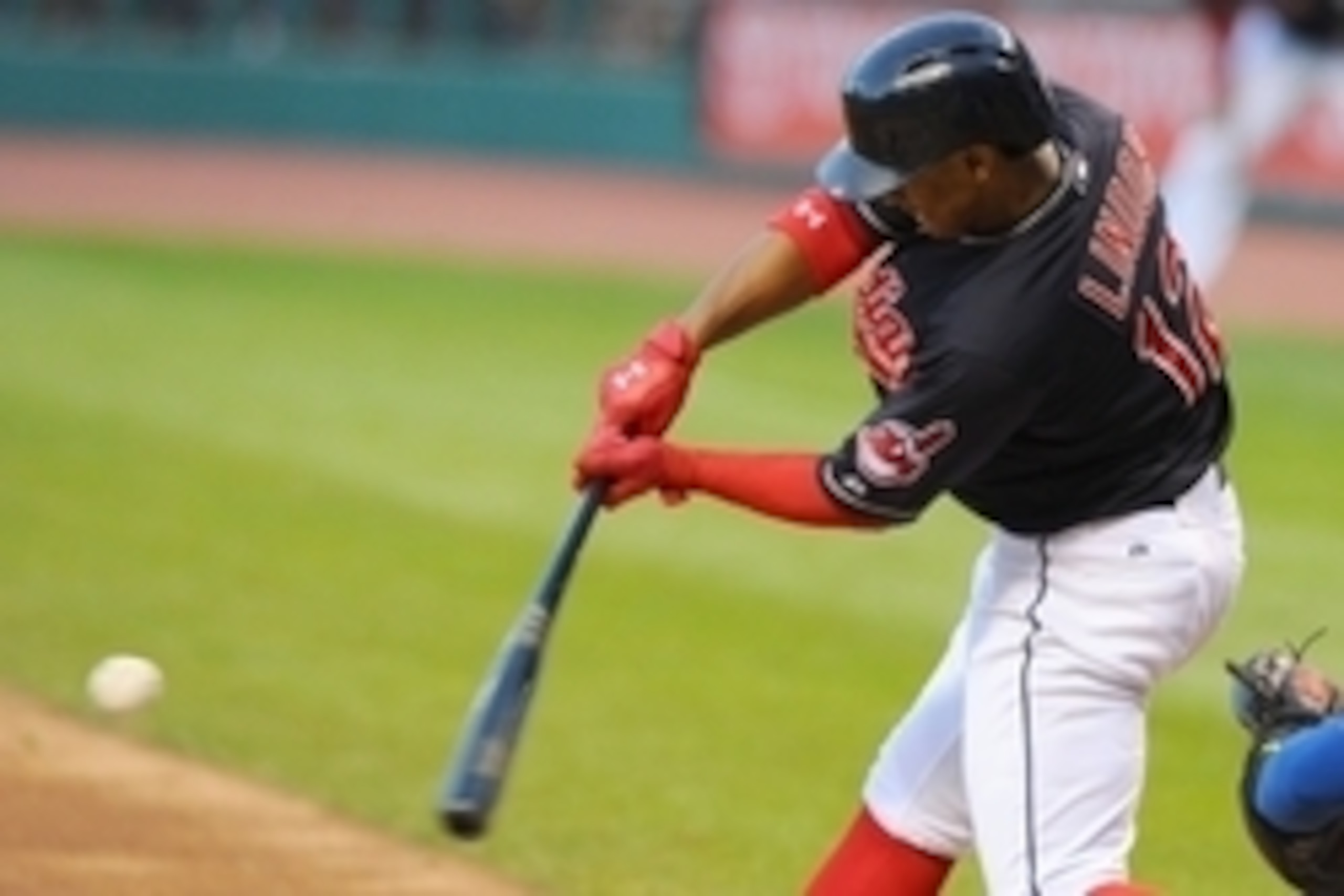 Sep 15, 2015; Cleveland, OH, USA; Cleveland Indians shortstop Francisco Lindor (12) hits a double during the first inning against the Kansas City Royals at Progressive Field. Mandatory Credit: Ken Blaze-USA TODAY Sports