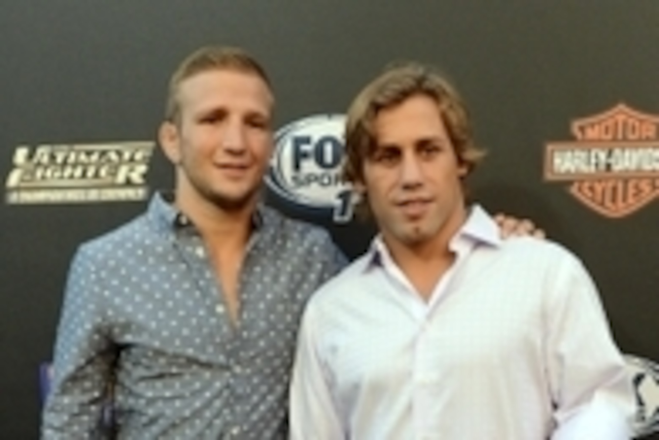 Sep 9, 2014; Los Angeles, CA, USA; UFC Bantamweight champion TJ Dillashaw and former WEC Bantamweight champion Urijah Faber arrive on the Red Carpet at Lure Nightclub for the premier of The Ultimate Fighter women in the newly formed women in the strawweig