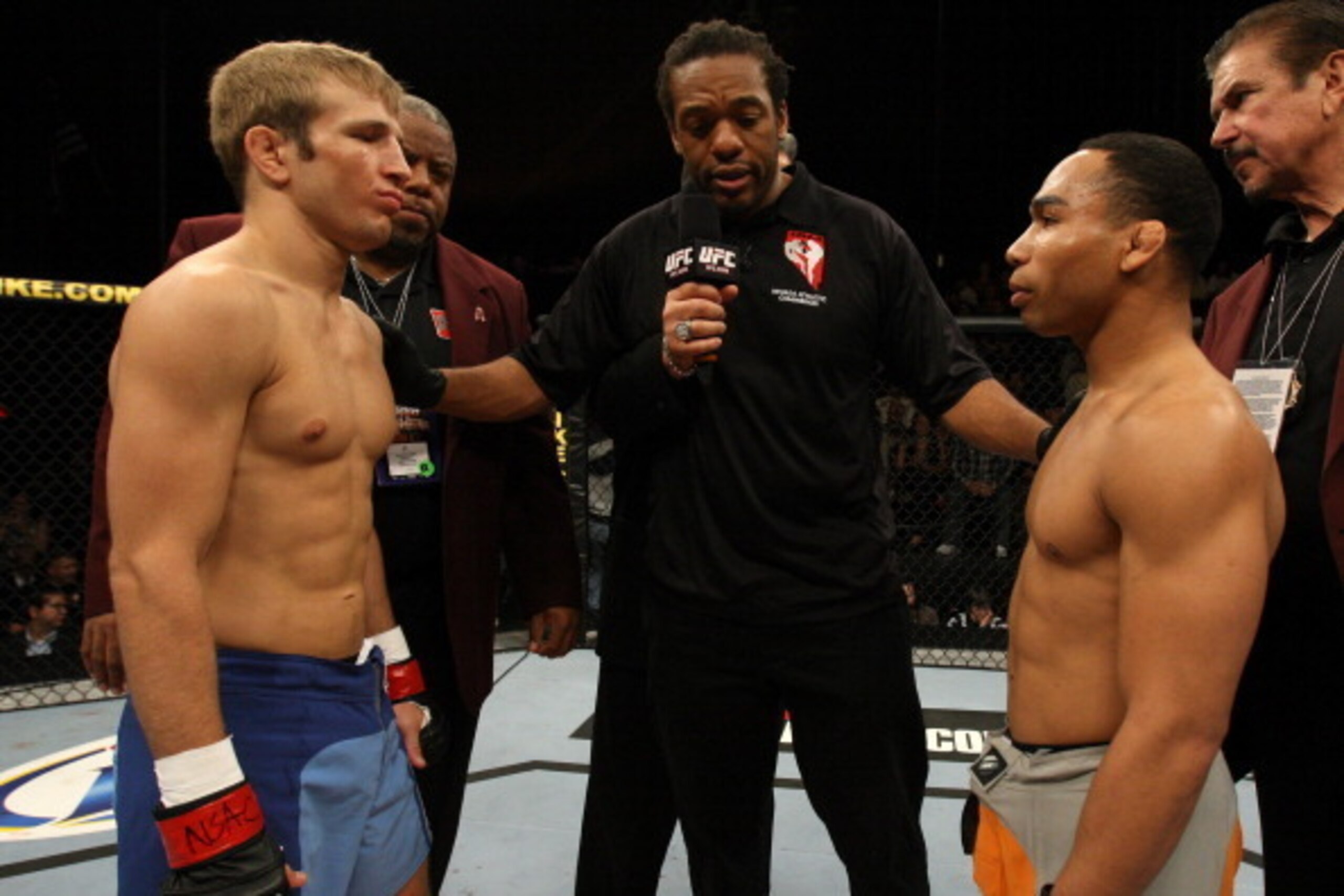 LAS VEGAS, NV - DECEMBER 03:  Opponents TJ Dillashaw (L) and John Dodson (R) receive final instructions from referee Herb Dean before thie bout during The Ultimate Fighter 14 Finale at the Pearl Theatre at the Palms Hotel and Casino on December 3, 2011 in