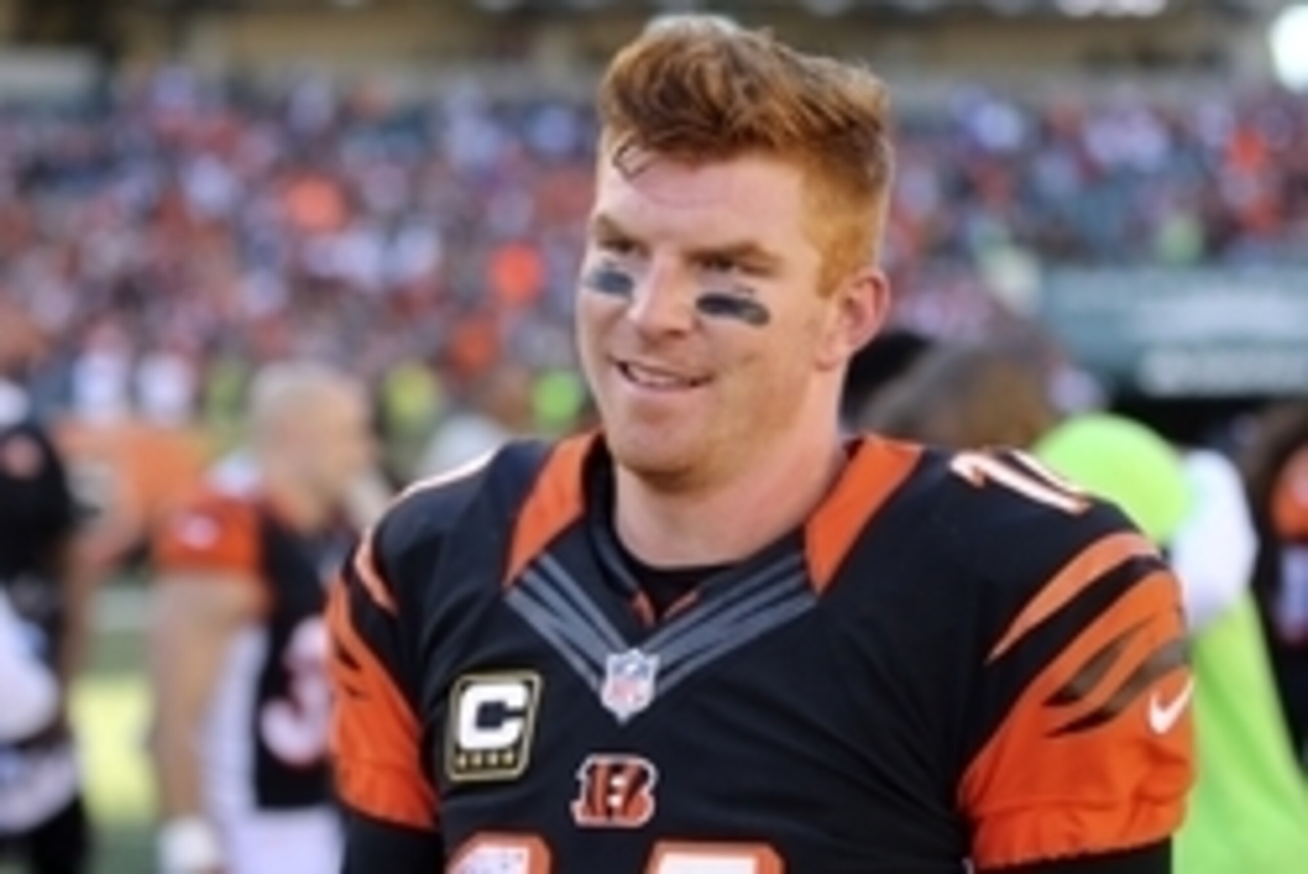 Oct 11, 2015; Cincinnati, OH, USA; Cincinnati Bengals quarterback Andy Dalton (14) walks off the field after defeating the Seattle Seahawks at Paul Brown Stadium. The Bengals won 27-24. Mandatory Credit: Aaron Doster-USA TODAY Sports