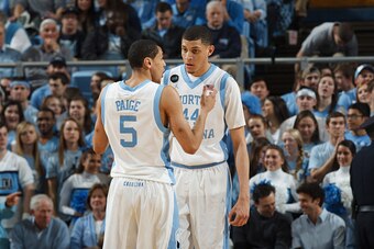 CHAPEL HILL, NC - FEBRUARY 21: Justin Jackson #44 of the North Carolina Tar Heels speaks to teammate Marcus Paige #5 during a game against the Georgia Tech Yellow Jackets on February 21, 2015 at the Dean E. Smith Center in Chapel Hill, North Carolina. Nor