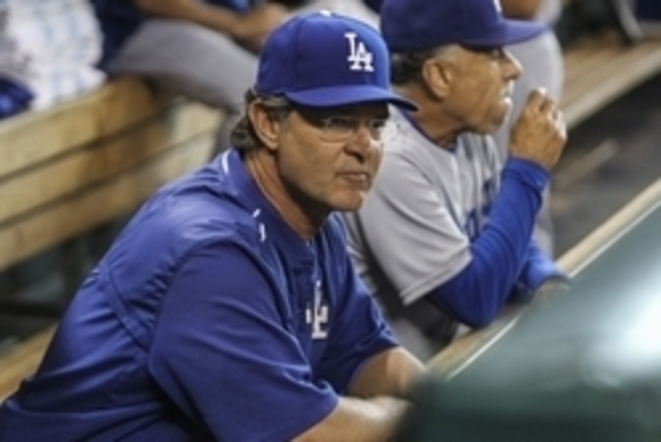 Aug 21, 2015; Houston, TX, USA; Los Angeles Dodgers manager Don Mattingly (8) looks on from the dugout prior to the game against the Houston Astros at Minute Maid Park. Mandatory Credit: Troy Taormina-USA TODAY Sports