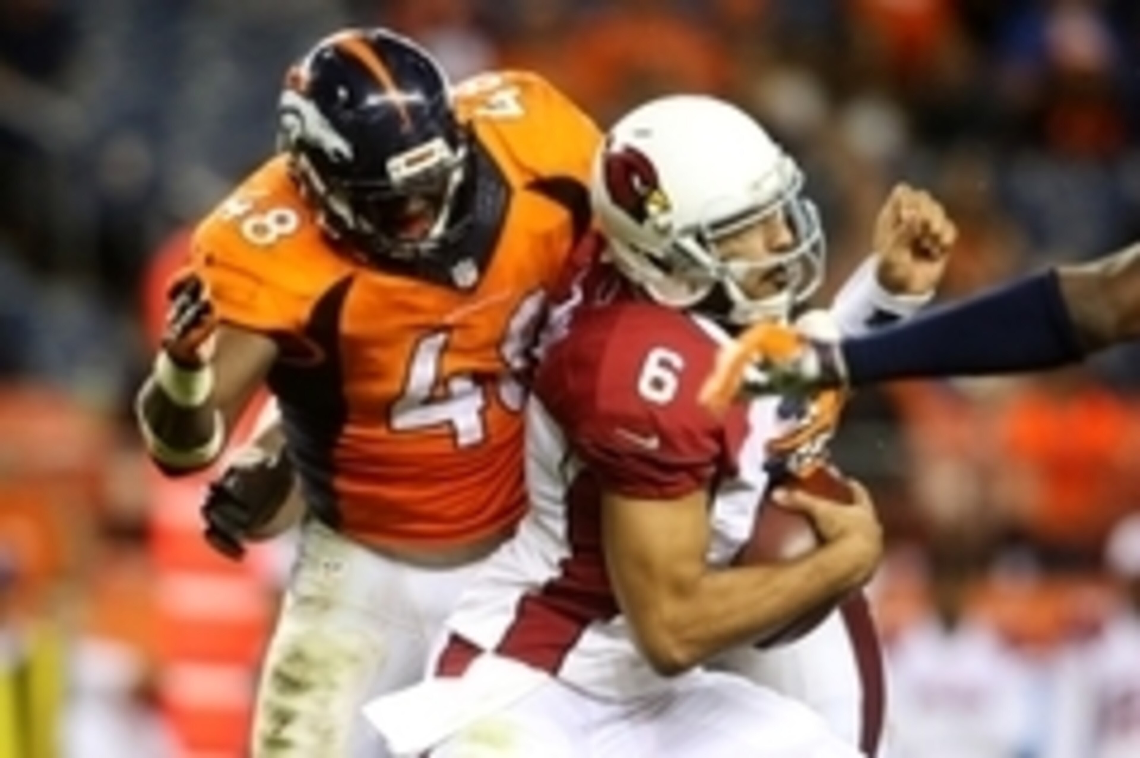 Sep 3, 2015; Denver, CO, USA; Denver Broncos linebacker Shaquil Barrett (48) sacks Arizona Cardinals quarterback Logan Thomas (6) during the second half at Sports Authority Field at Mile High. The Cardinals won 20-22. Mandatory Credit: Chris Humphreys-USA