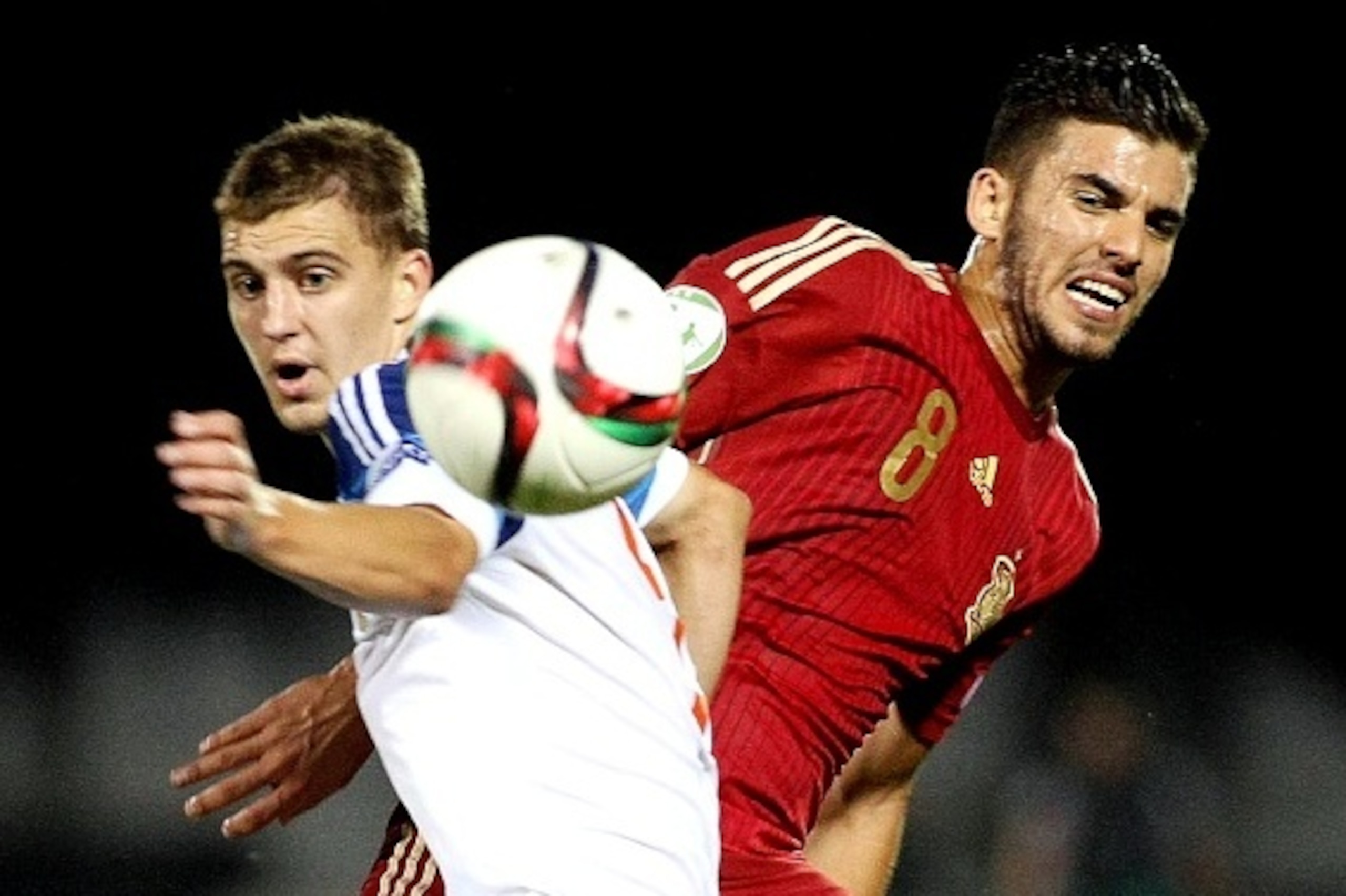 Russia's Denis Yakuba (L) vies for the ball with Spain's Dani Ceballos (R) during the UEFA 2015 European U-19 Championship final football match between Russia and Spain at the Municipal Stadium in Katerini, Greece, on July 19, 2015. AFP PHOTO / STRINGER  