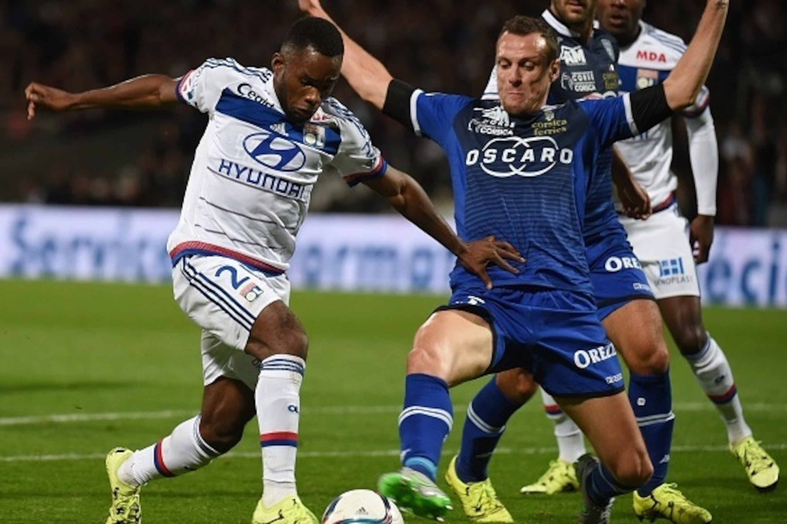 Lyon's French forward Aldo Kalulu (L) vies with Bastia's French defender Sebastien Squillaci (R) during the French L1 football match between Olympique Lyonnais against Sporting Club de Bastia on September 23, 2015 at the Gerland stadium in Lyon, Southeast