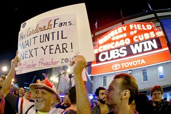 CHICAGO, IL - OCTOBER 13: The Bleacher Preacher holds up a sign with a message for St Louis Cardinal fans after the Chicago Cubs beat the St. Louis Cardinals in Game Four to win the National League Divisional Series on October 13, 2015 in Chicago, Illinoi