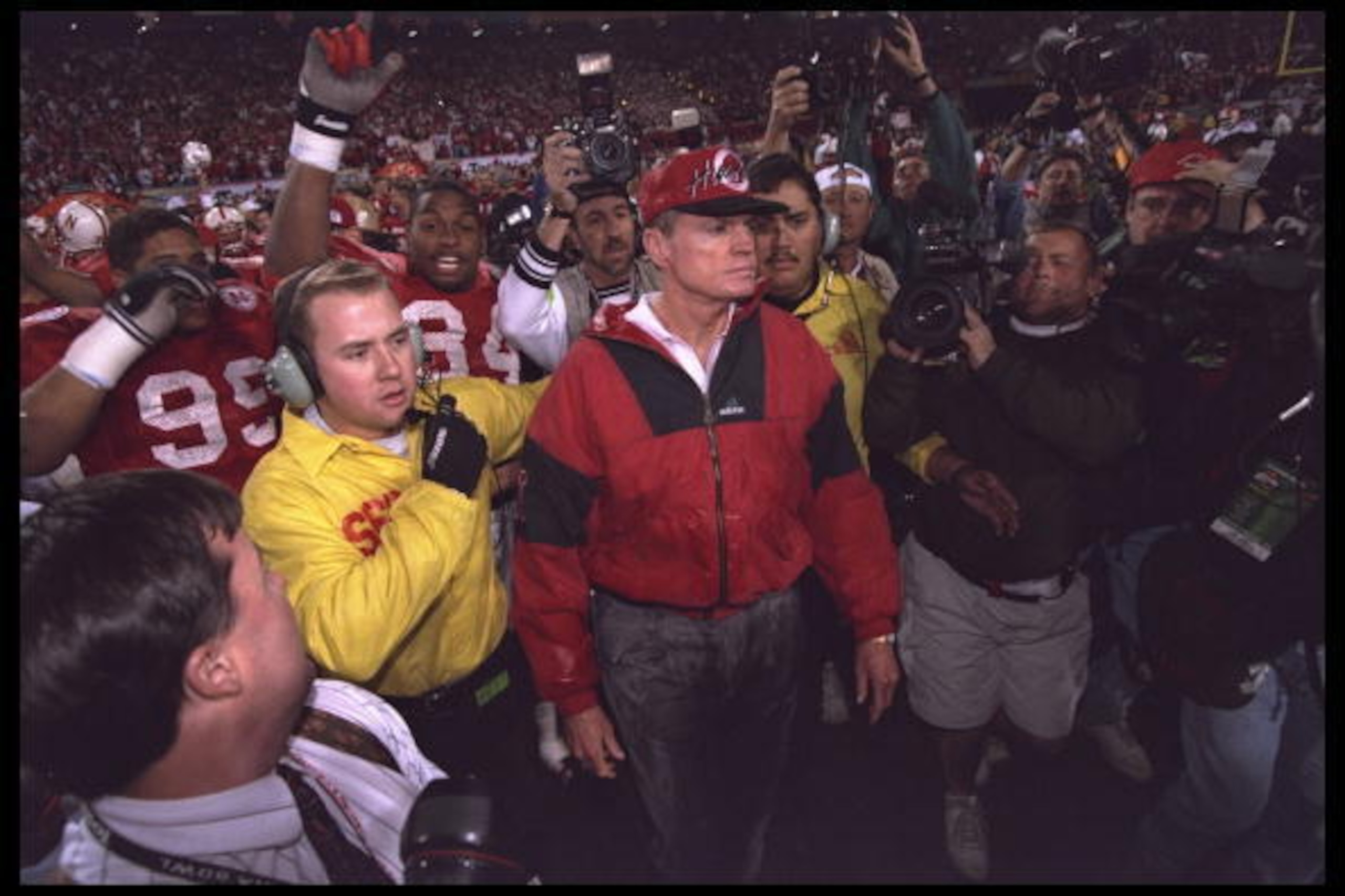 2 Jan 1996:  Head coach Tom Osborne of the Nebraska Cornhuskers walks triumphant off the field in front of his team leading them to defeat the Florida Gators in the Fiesta Bowl at Sun Devil Stadium in Tempe, Arizona.  Nebraska defeated Florida 62-24.  Man