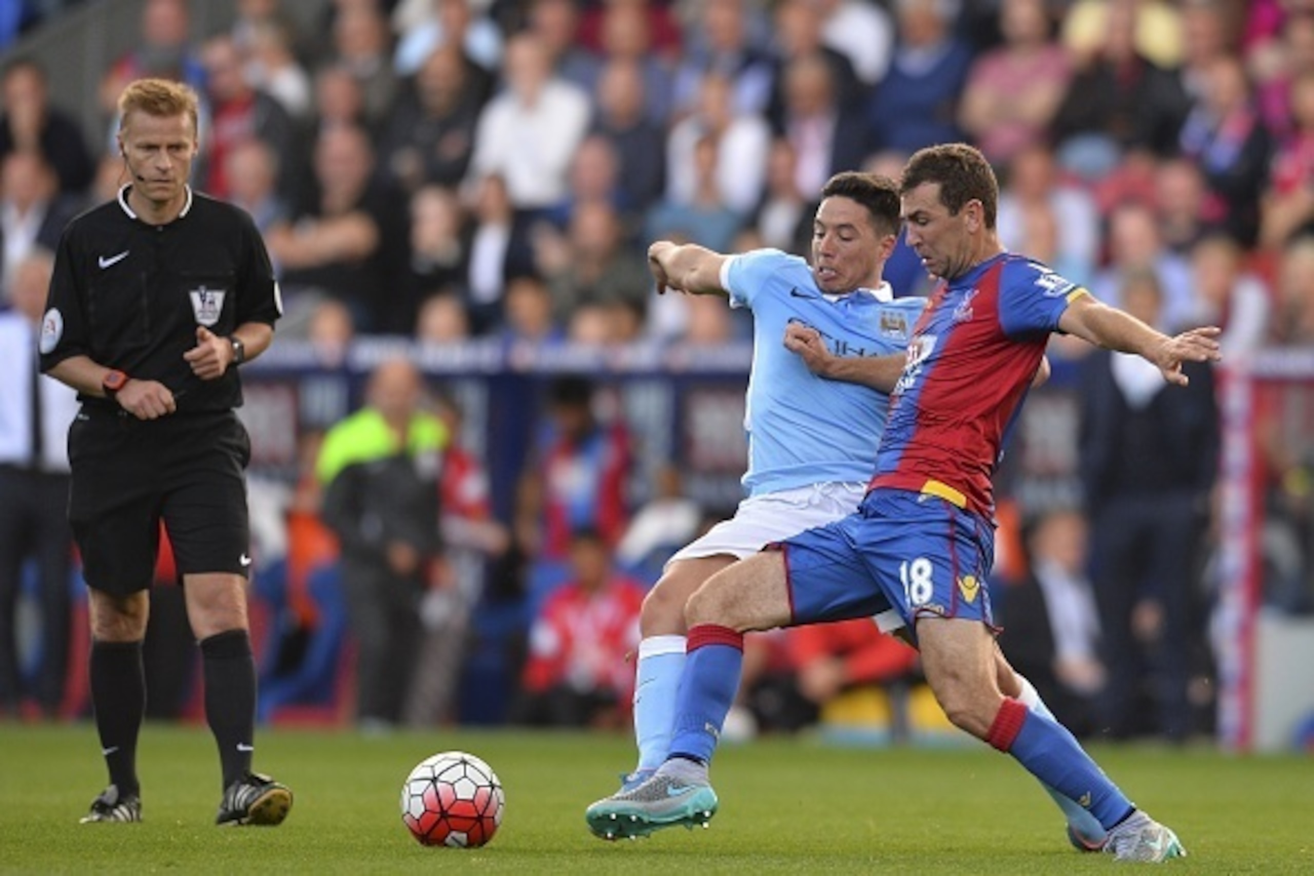 Manchester City's French midfielder Samir Nasri (2R) vies with Crystal Palace's Scottish midfielder James McArthur (R) during the English Premier League football match between Crystal Palace and Manchester City at Selhurst Park in London on September 12, 
