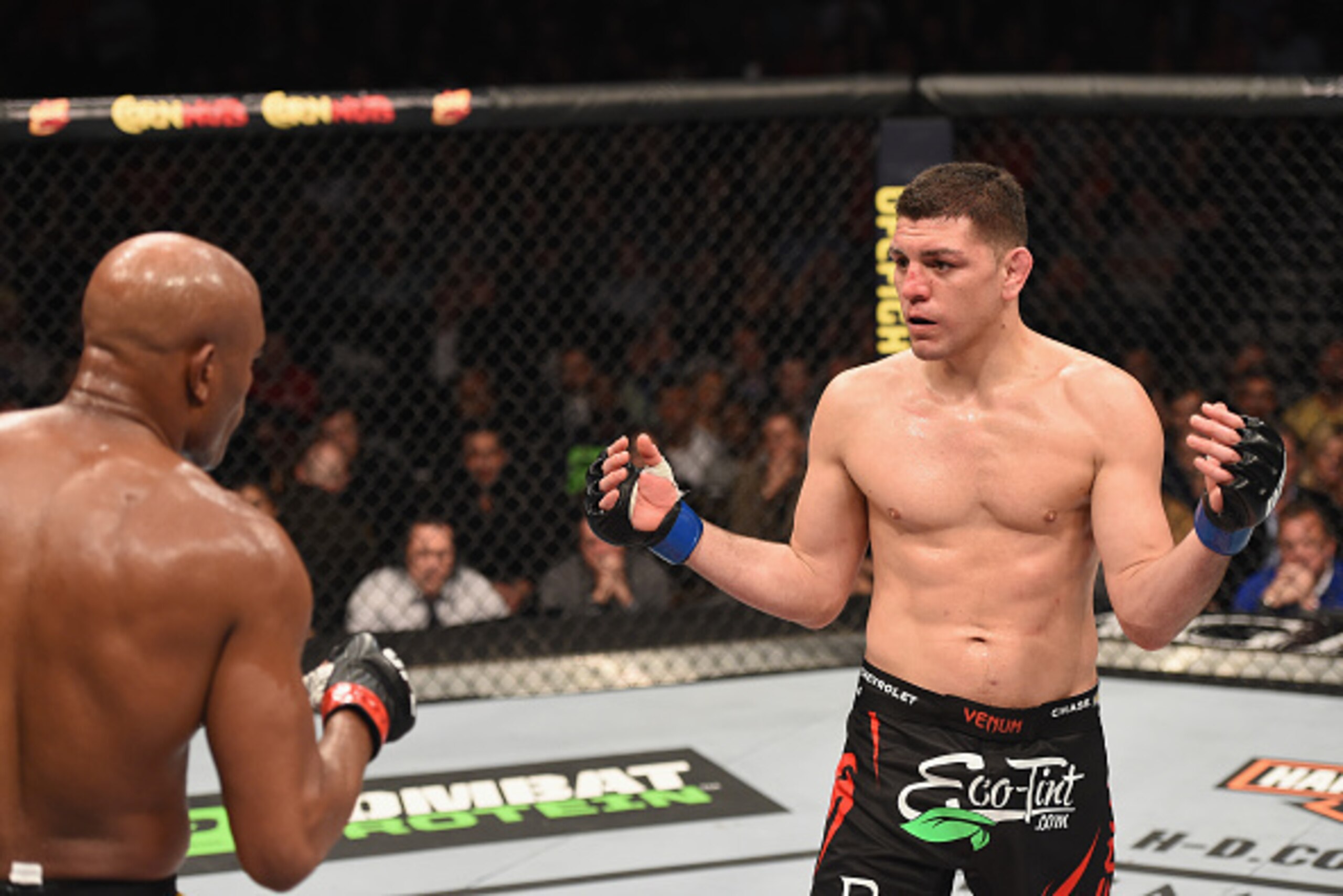 LAS VEGAS, NV - JANUARY 31:  (R-L) Nick Diaz taunts Anderson Silva of Brazil in their middleweight bout during the UFC 183 event at the MGM Grand Garden Arena on January 31, 2015 in Las Vegas, Nevada.  (Photo by Josh Hedges/Zuffa LLC/Zuffa LLC via Getty I