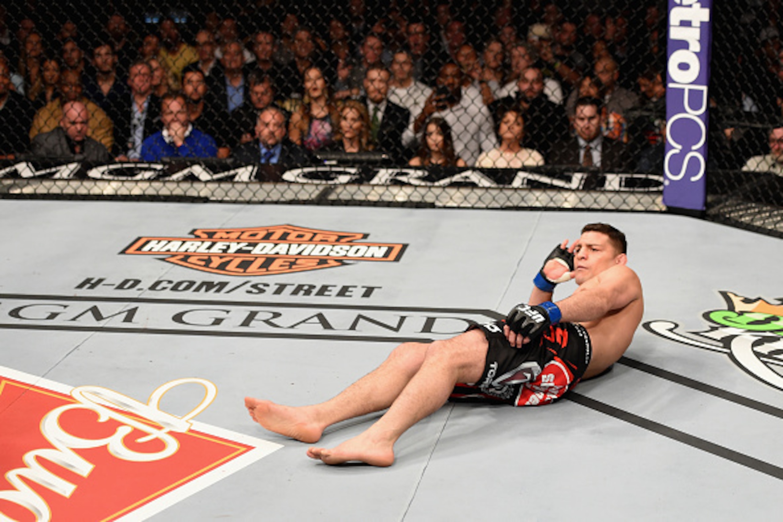 LAS VEGAS, NV - JANUARY 31:  Nick Diaz taunts his opponent in their middleweight bout during the UFC 183 event at the MGM Grand Garden Arena on January 31, 2015 in Las Vegas, Nevada.  (Photo by Josh Hedges/Zuffa LLC/Zuffa LLC via Getty Images)