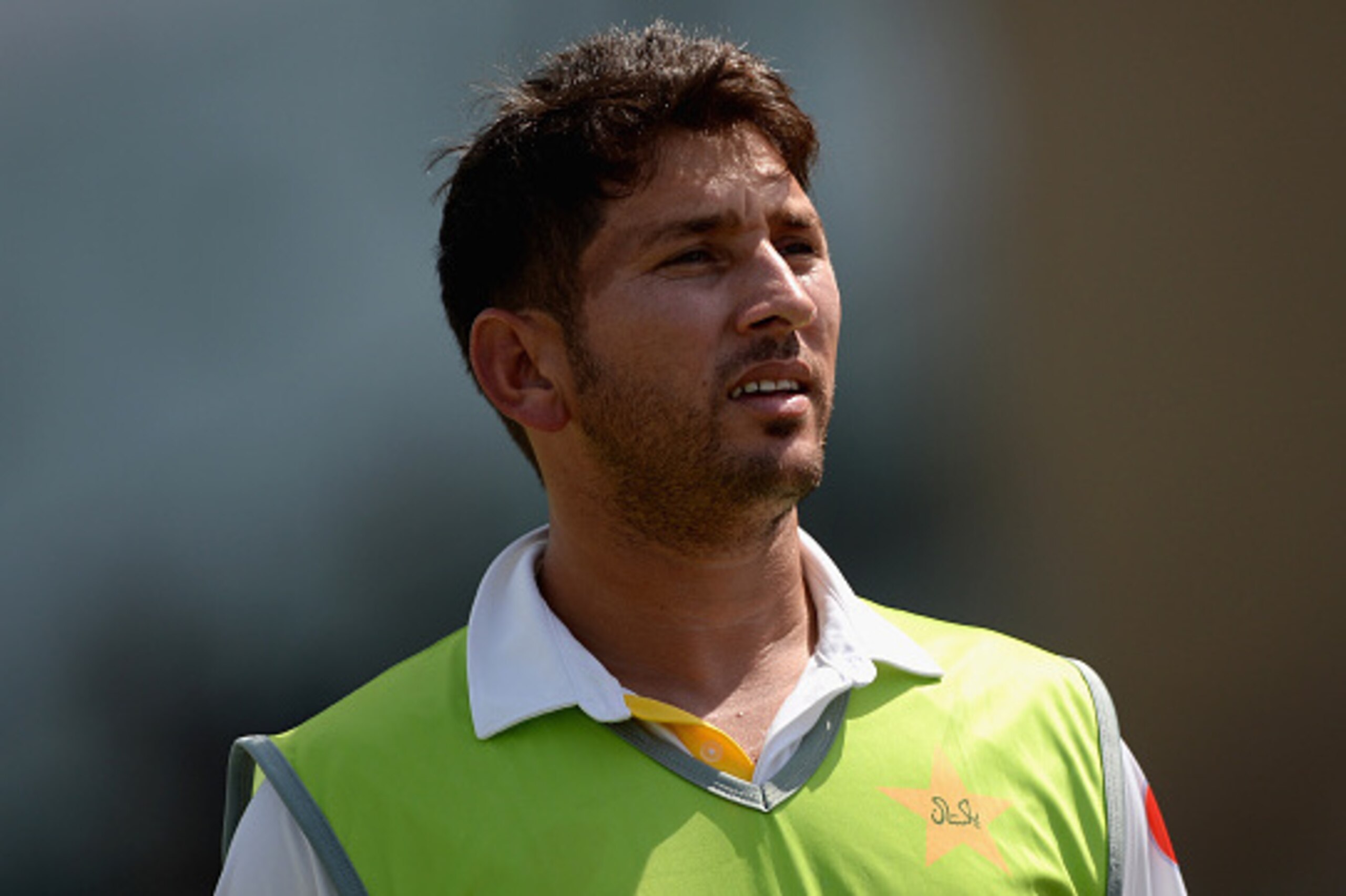 ABU DHABI, UNITED ARAB EMIRATES - OCTOBER 16:  Yasir Shah of Pakistan watches from the  oundary edge during day four of the 1st Test between Pakistan and England at Zayed Cricket Stadium on October 16, 2015 in Abu Dhabi, United Arab Emirates.  (Photo by G