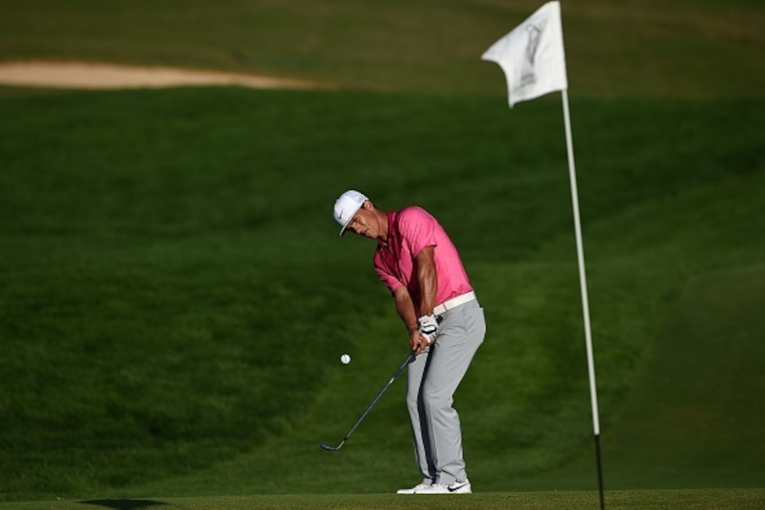 Belgian golfer Thomas Pieters plays a shot on the 18th green during the second round of Portugal Masters golf tournament at Oceanico golf course in Vilamoura on October 16, 2015.   AFP PHOTO/ FRANCISCO LEONG        (Photo credit should read FRANCISCO LEON
