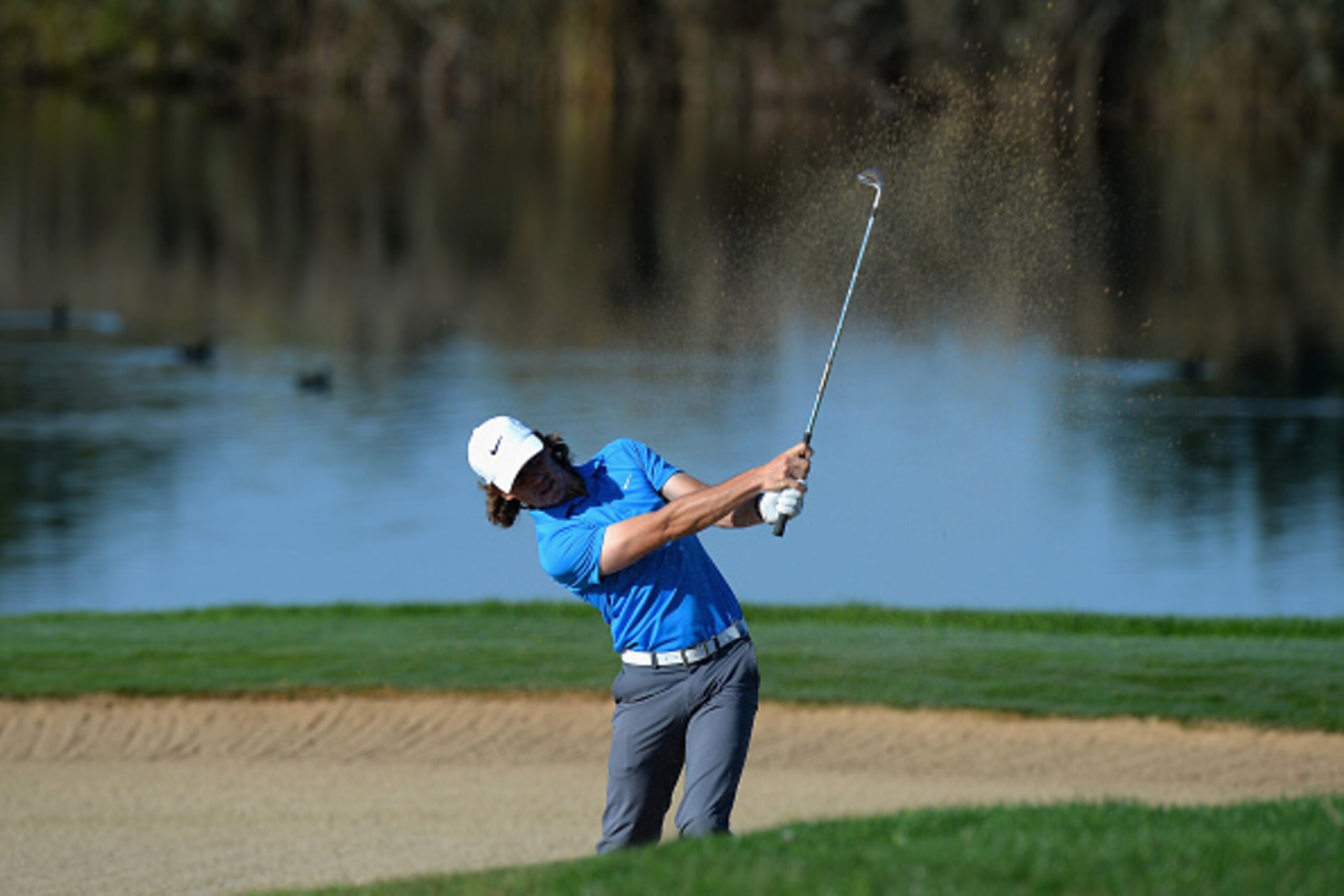 ALBUFEIRA, PORTUGAL - OCTOBER 16:  Tommy Fleetwood of England plays his second shot out of a bunker on the 14th fairway during the second day of the Portugal Masters at Oceanico Victoria Golf Club on October 16, 2015 in Albufeira, Portugal.  (Photo by Ton