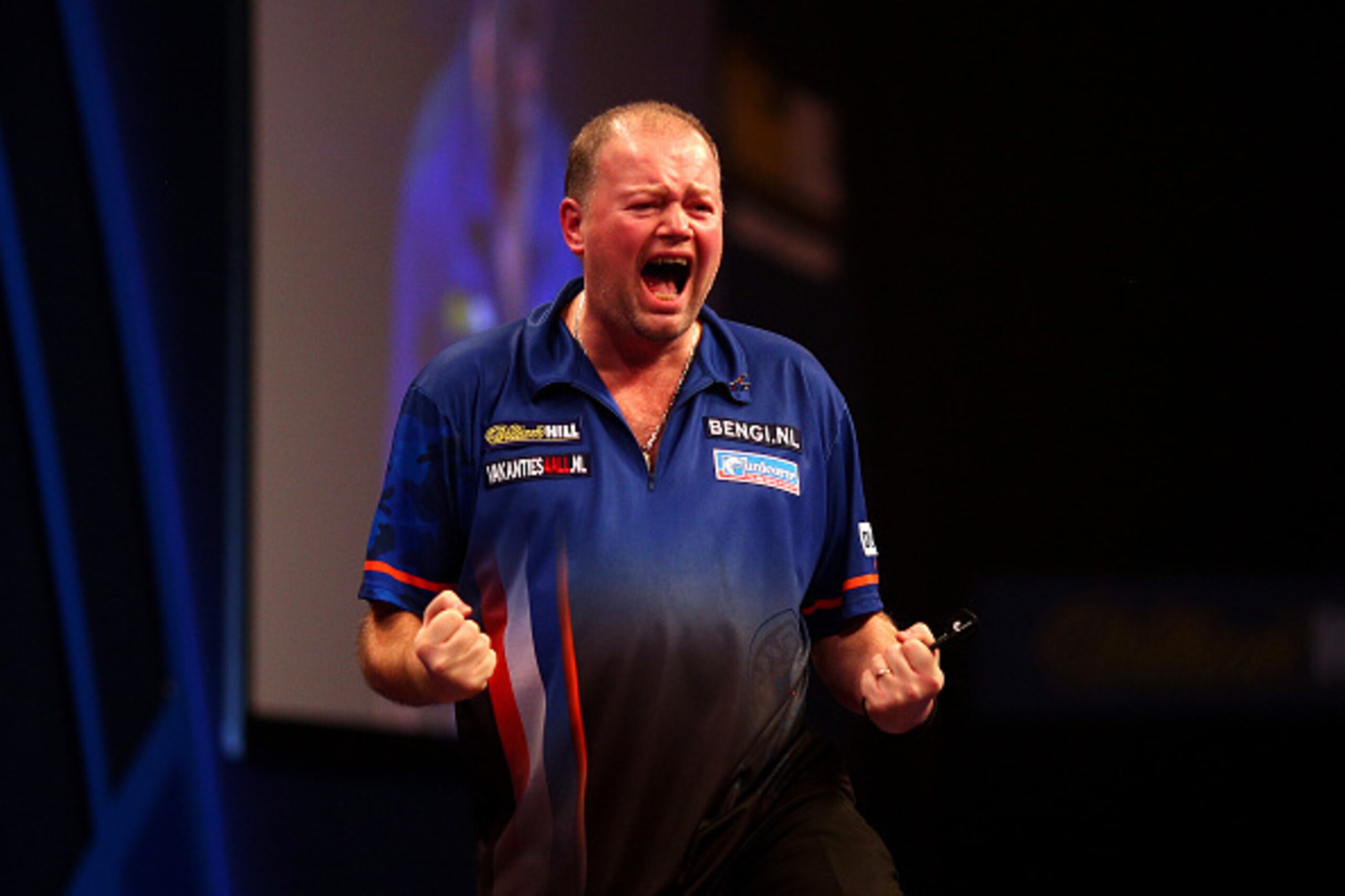 LONDON, ENGLAND - DECEMBER 30: Raymond van Barneveld of Holland celebrates winning his third round match against Adrian Lewis of England during the William Hill PDC World Darts Championships on Day Ten at Alexandra Palace on December 30, 2014 in London, E LONDON, ENGLAND - DECEMBER 30: Raymond van Barneveld of Holland celebrates winning his third round match against Adrian Lewis of England during the William Hill PDC World Darts Championships on Day Ten at Alexandra Palace on December 30, 2014 in London, E