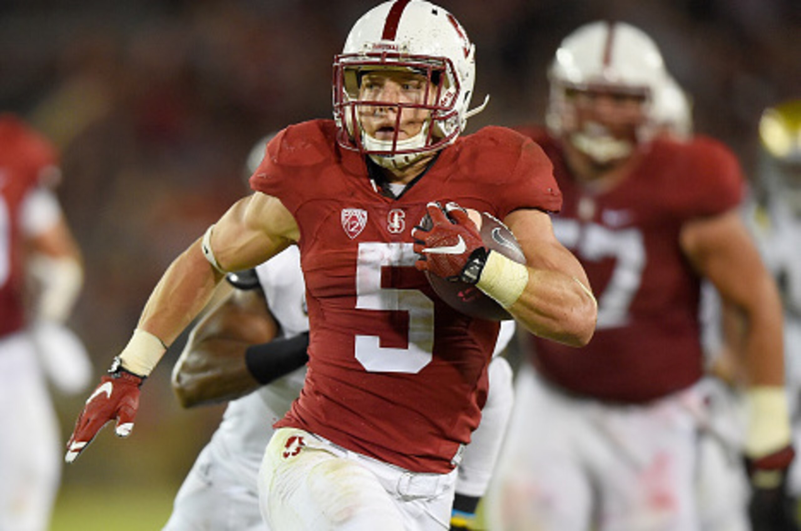 PALO ALTO, CA - OCTOBER 15: Christian McCaffrey #5 of the Stanford Cardinal's rushes for a twenty eight yard touchdown run against the UCLA Bruins in the second quarter of an NCAA football game at Stanford Stadium on October 15, 2015 in Stanford, Califor PALO ALTO, CA - OCTOBER 15: Christian McCaffrey #5 of the Stanford Cardinal's rushes for a twenty eight yard touchdown run against the UCLA Bruins in the second quarter of an NCAA football game at Stanford Stadium on October 15, 2015 in Stanford, Califor