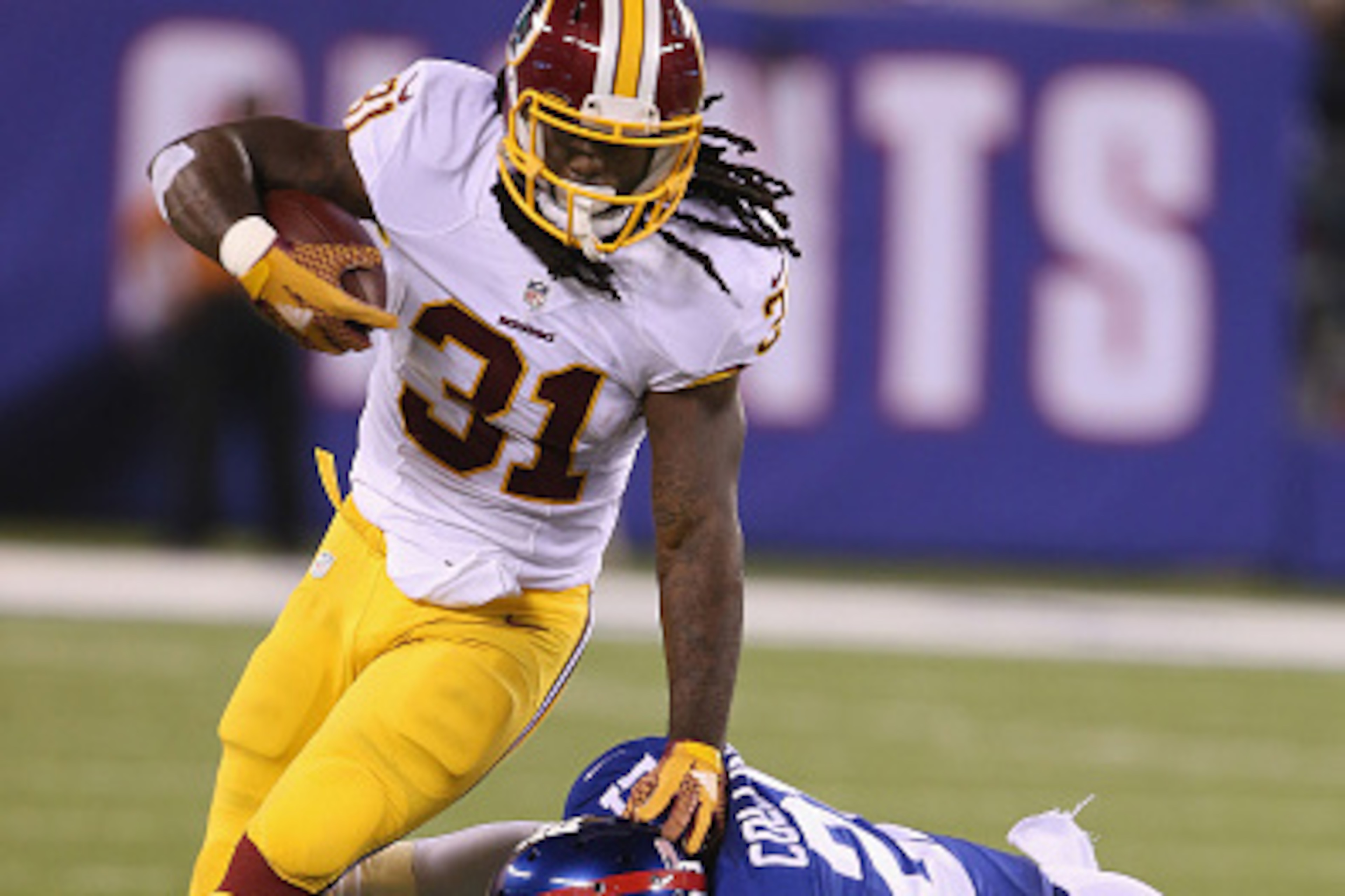 EAST RUTHERFORD, NJ - SEPTEMBER 24:  Running Back Matt Jones #31 of the Washington Redskins has a long gain against the New York Giants at MetLife Stadium on September 24, 2015 in East Rutherford, New Jersey.  (Photo by Al Pereira/Getty Images/New York Je