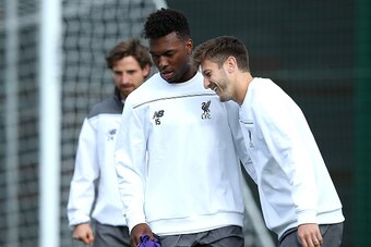 LIVERPOOL, ENGLAND - SEPTEMBER 30:  Daniel Sturridge shares a joke with Adam Lallana during a Liverpool FC training session at Melwood Training Ground on September 30, 2015 in Liverpool, England.  (Photo by Jan Kruger/Getty Images)