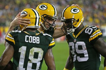 GREEN BAY, WI - SEPTEMBER 28: Aaron Rodgers #12 of the Green Bay Packers congratulates Randall Cobb #18 and James Jones #89 after a touchdown against the Kansas City Chiefs at Lambeau Field on September 28, 2015 in Green Bay, Wisconsin. The Packers defeat