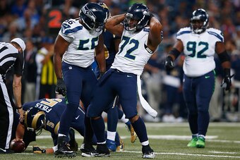 ST. LOUIS, MO - SEPTEMBER 13: Michael Bennett #72 of the Seattle Seahawks celebrates a first half sack against the St. Louis Rams at the Edward Jones Dome on September 13, 2015 in St. Louis, Missouri. (Photo by Jamie Squire/Getty Images)