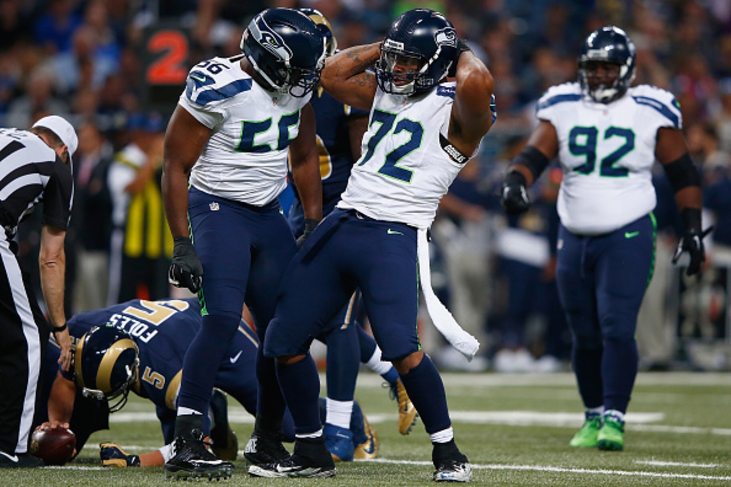 ST. LOUIS, MO - SEPTEMBER 13: Michael Bennett #72 of the Seattle Seahawks celebrates a first half sack against the St. Louis Rams at the Edward Jones Dome on September 13, 2015 in St. Louis, Missouri. (Photo by Jamie Squire/Getty Images)